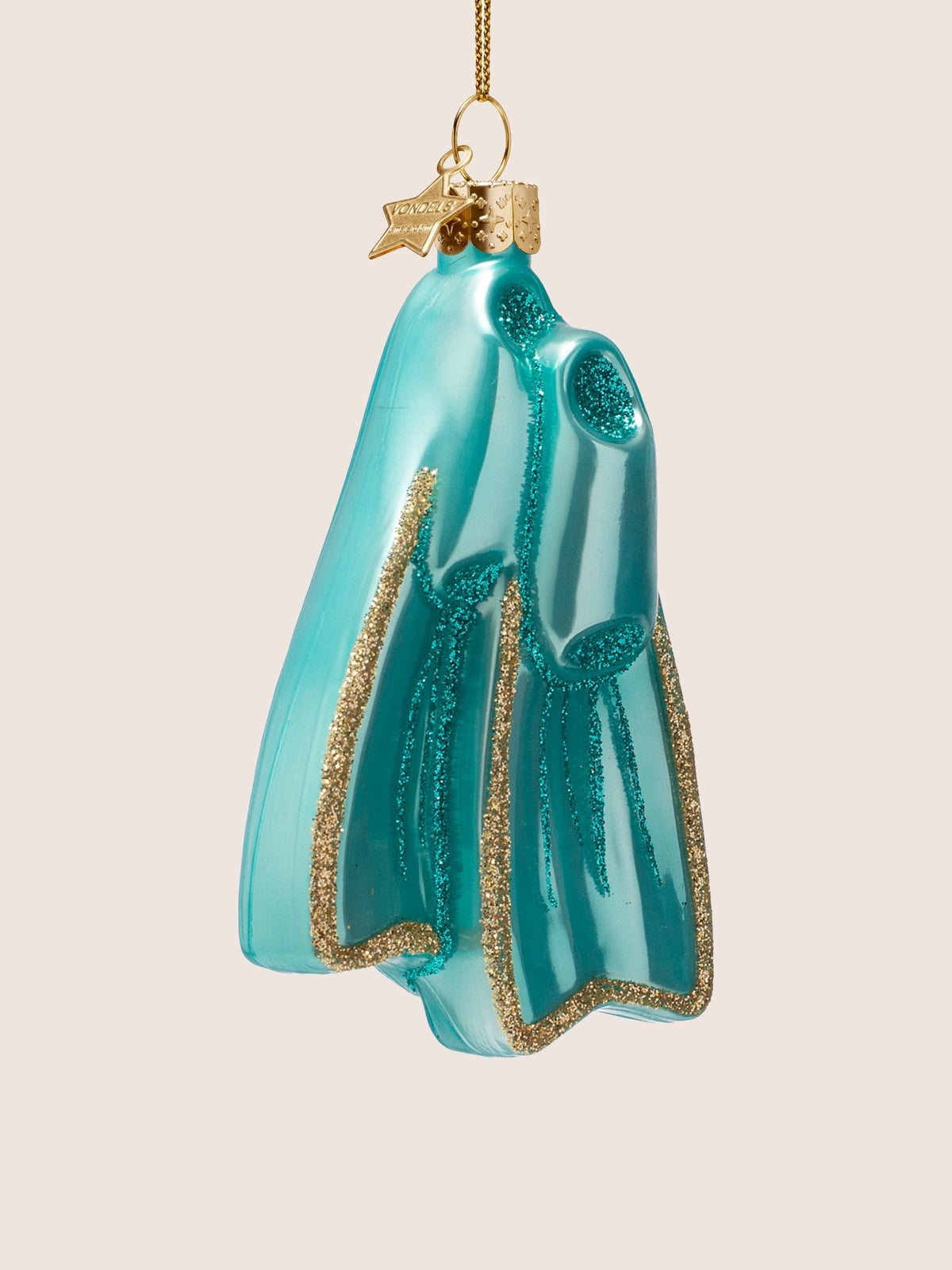 Three-quarter view of the flippers showing the hollow foot pockets and turquoise glitter ribs
