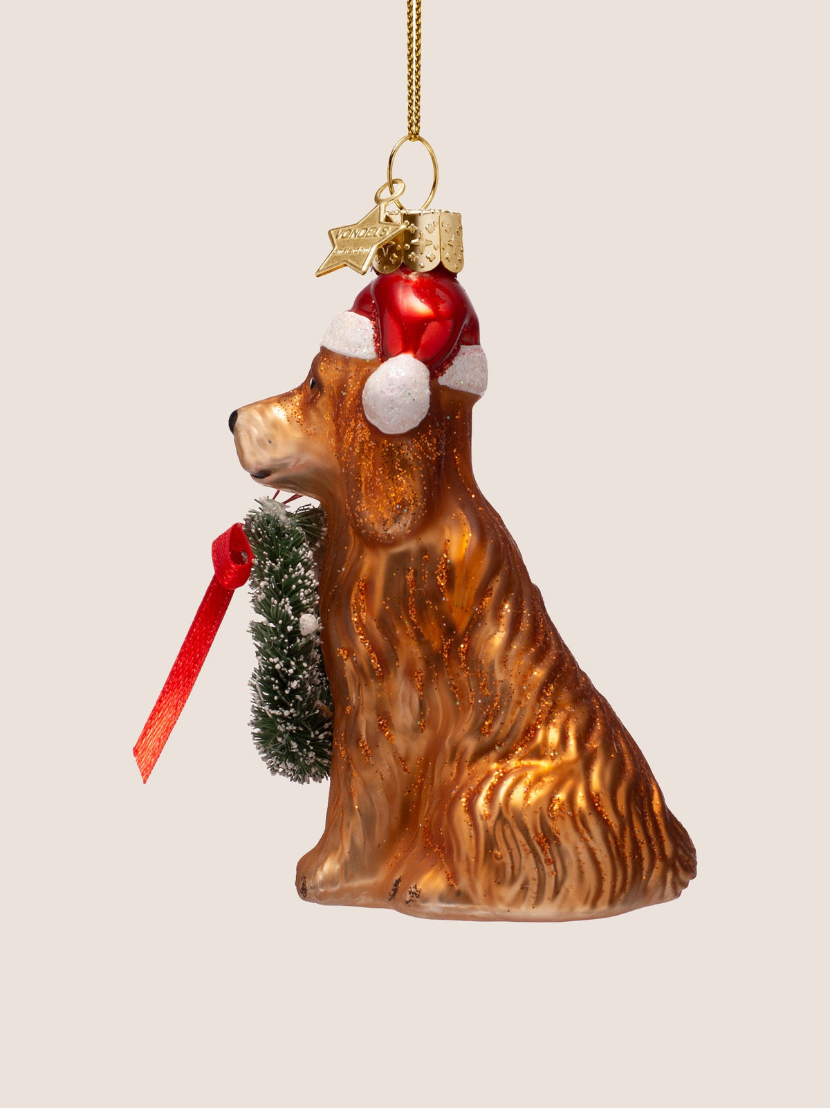 Left profile displaying the folded Santa hat with white pom-pom and textured glass coat