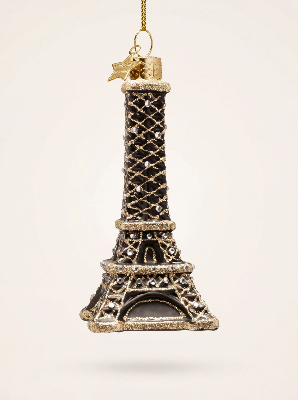 Eiffel Tower ornament in black glass with gold glitter lattice, clear faceted stones and a star tag