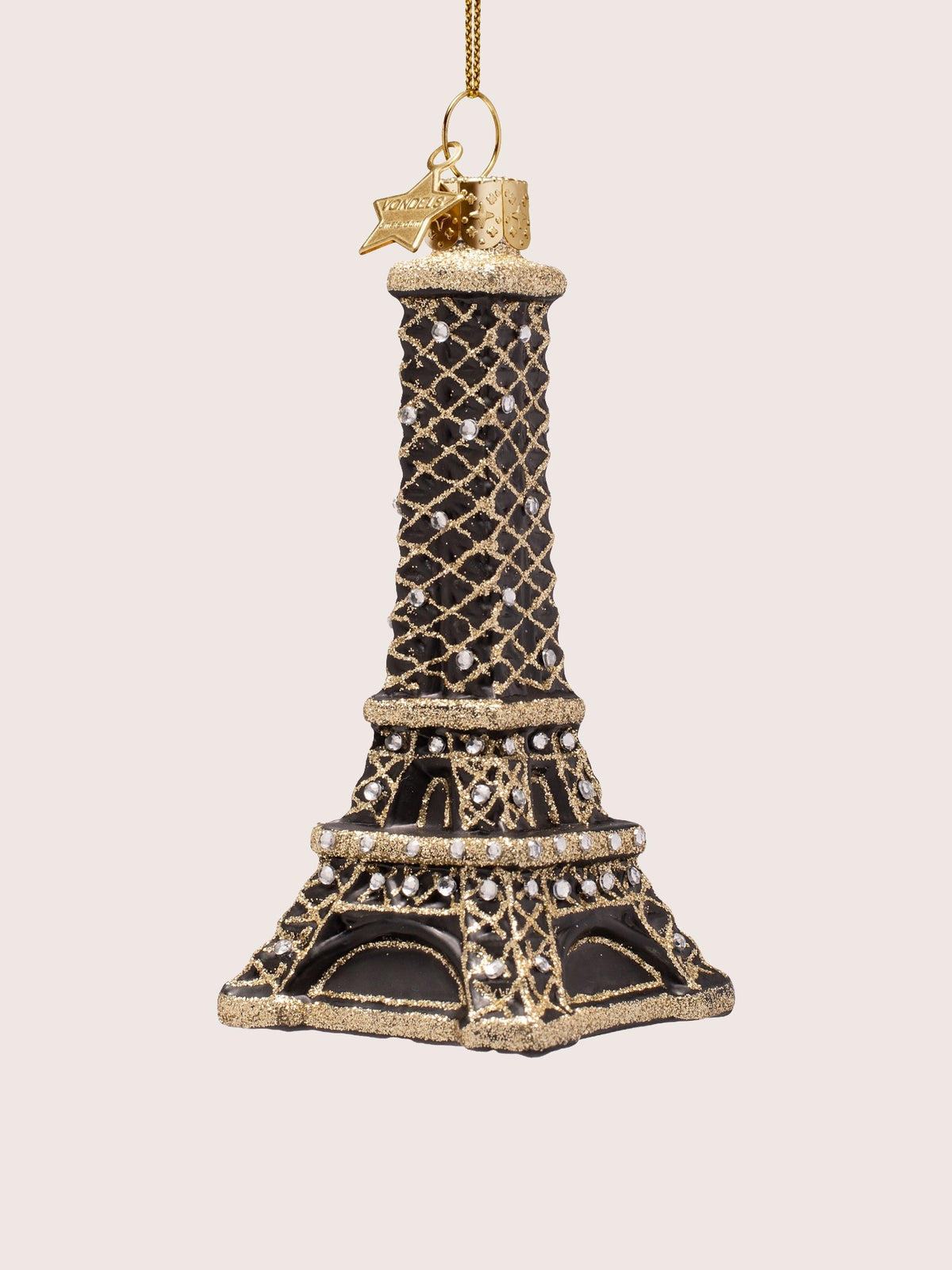 Eiffel Tower ornament angled to show the four-sided lattice structure and square glitter-trimmed base