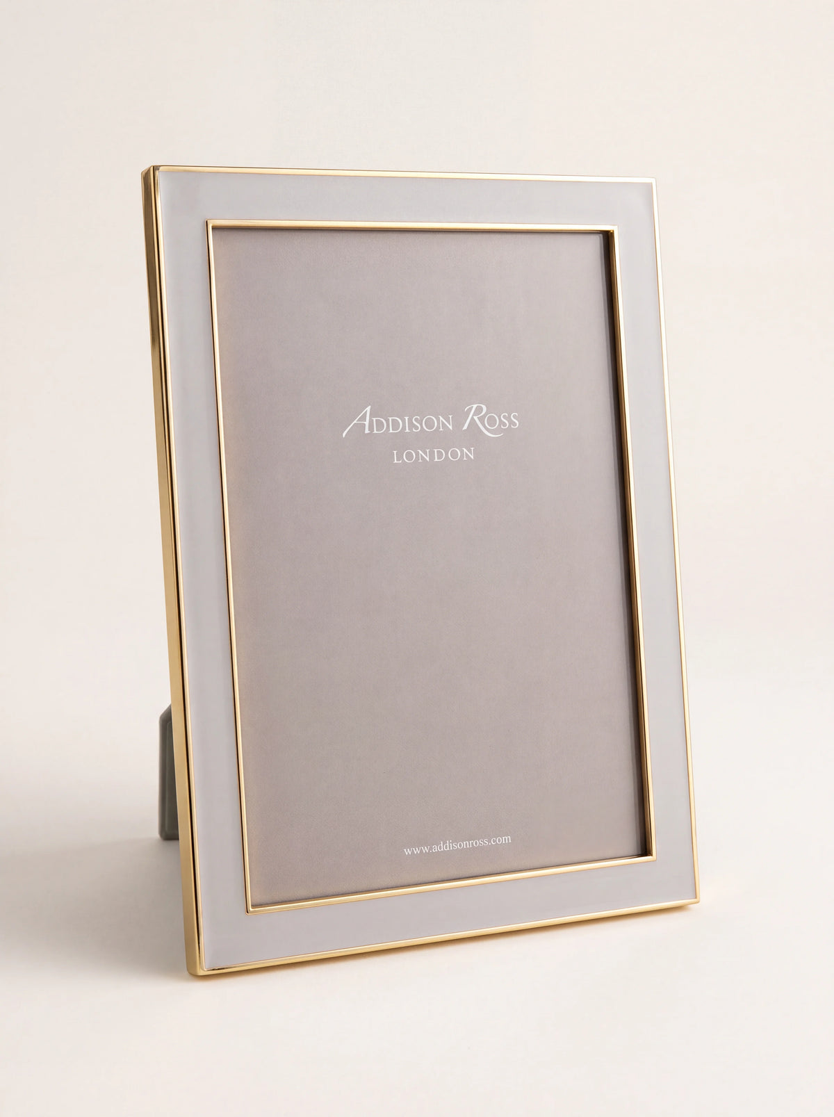 Chiffon grey enamel photo frame with gold-tone trim, standing in portrait orientation