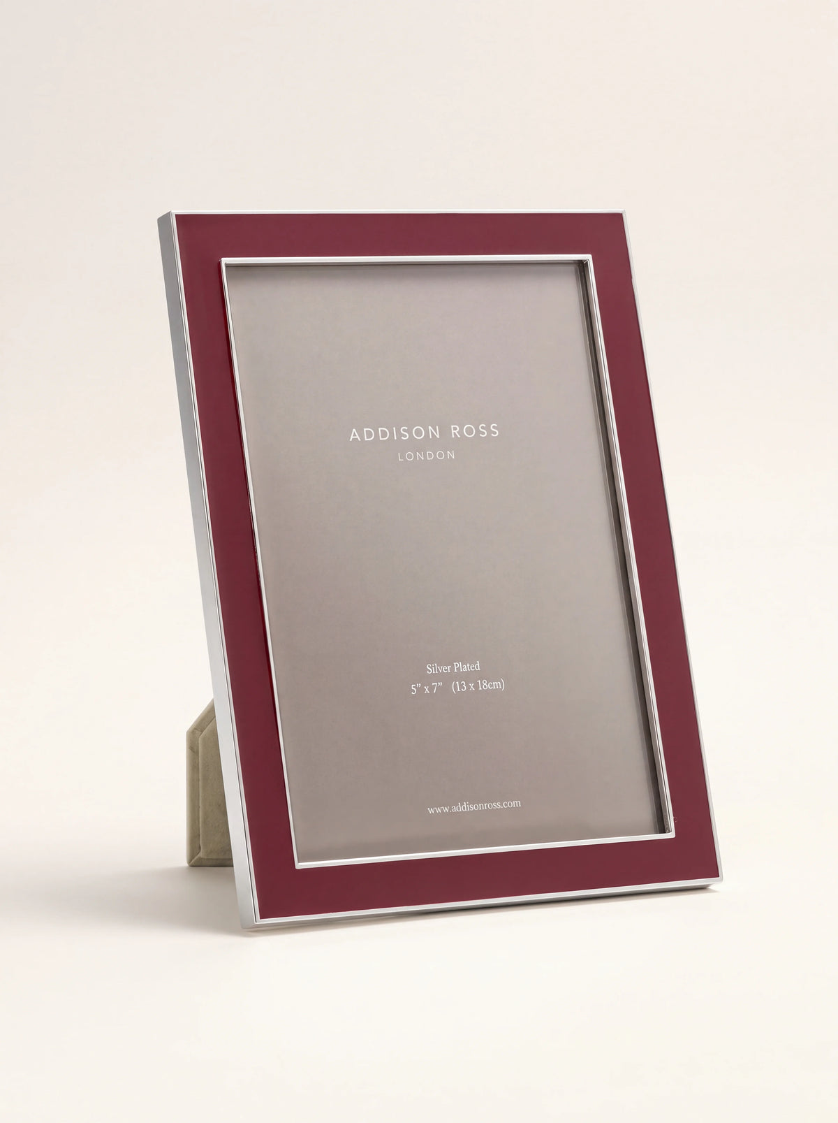 Silver-plated photo frame with a cherry red enamel border, standing upright in portrait orientation