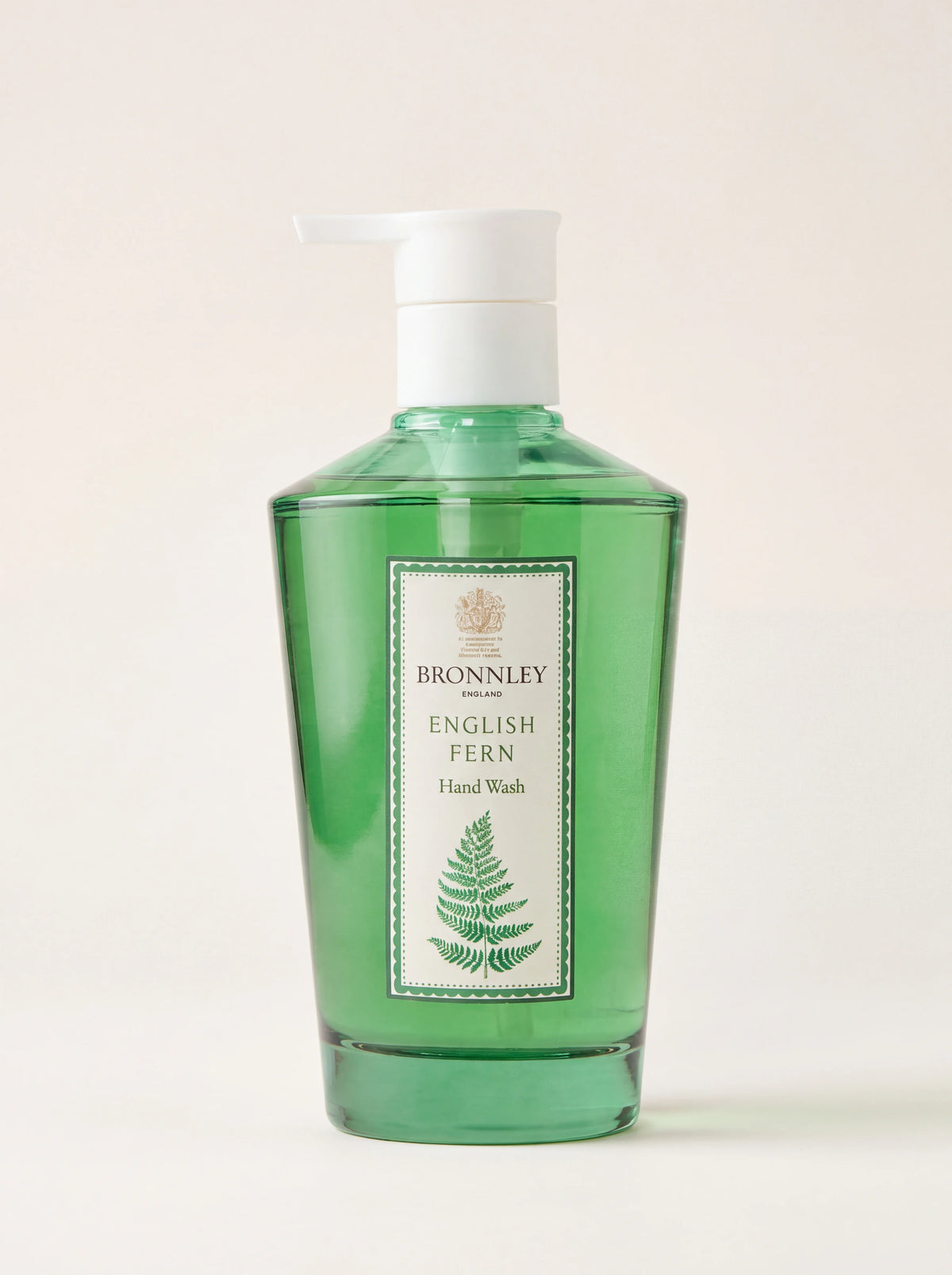 Liquid hand wash in a green glass bottle with a white pump dispenser, labelled English Fern Hand Wash