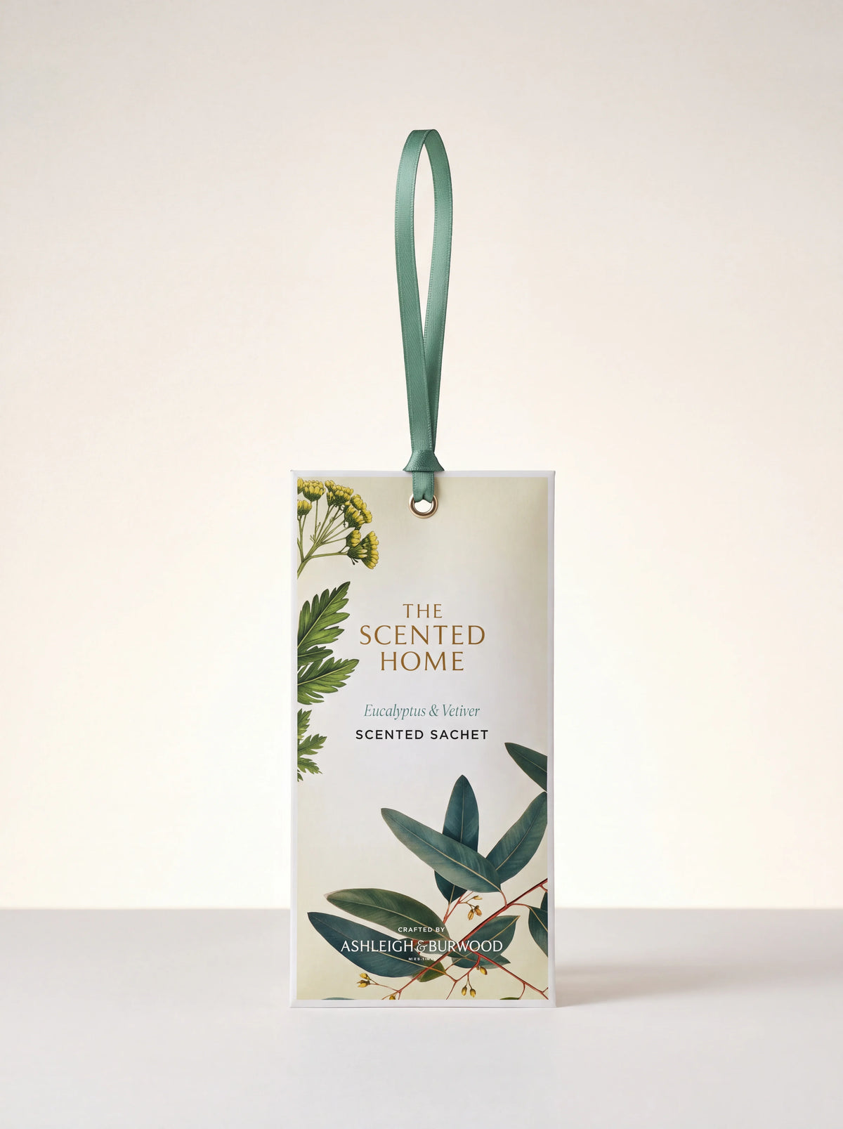 Scented sachet labelled The Scented Home Eucalyptus & Vetiver, with botanical foliage and a green hanging ribbon