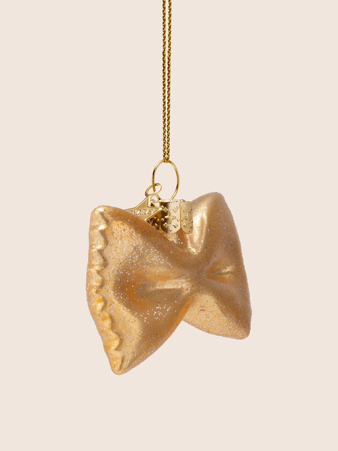 Three-quarter view of the farfalle ornament showing the pinched centre and contoured shape