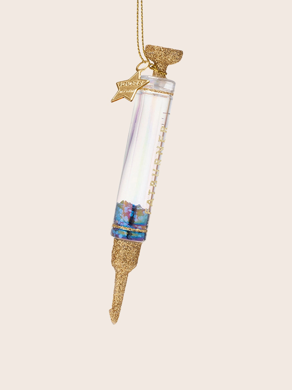 Angled view of the syringe ornament showing the iridescent sheen on the clear glass barrel
