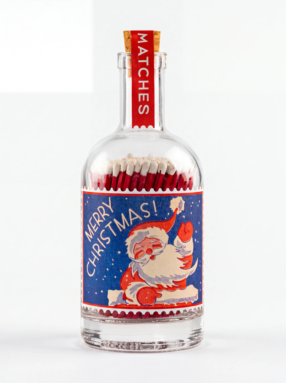 Clear glass match bottle with cork stopper and stamp label showing Father Christmas and Merry Christmas!