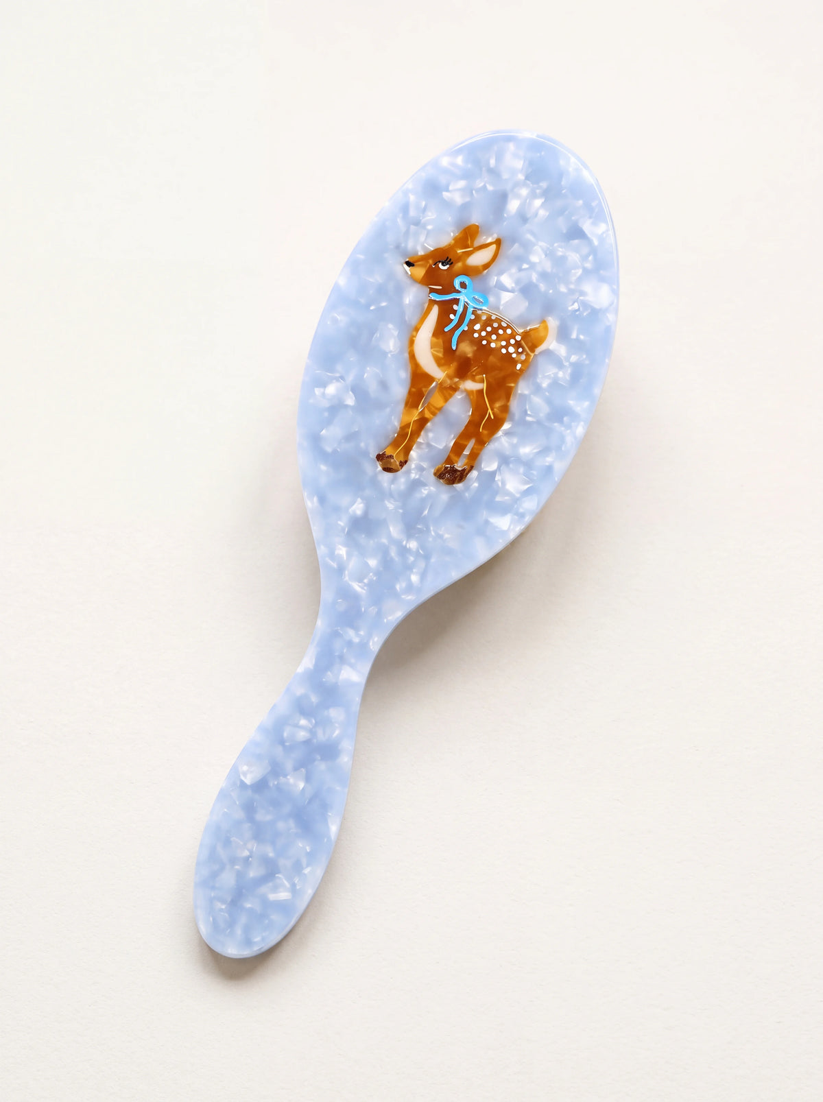 Light blue marbled acetate hairbrush with a hand-painted fawn motif on the back