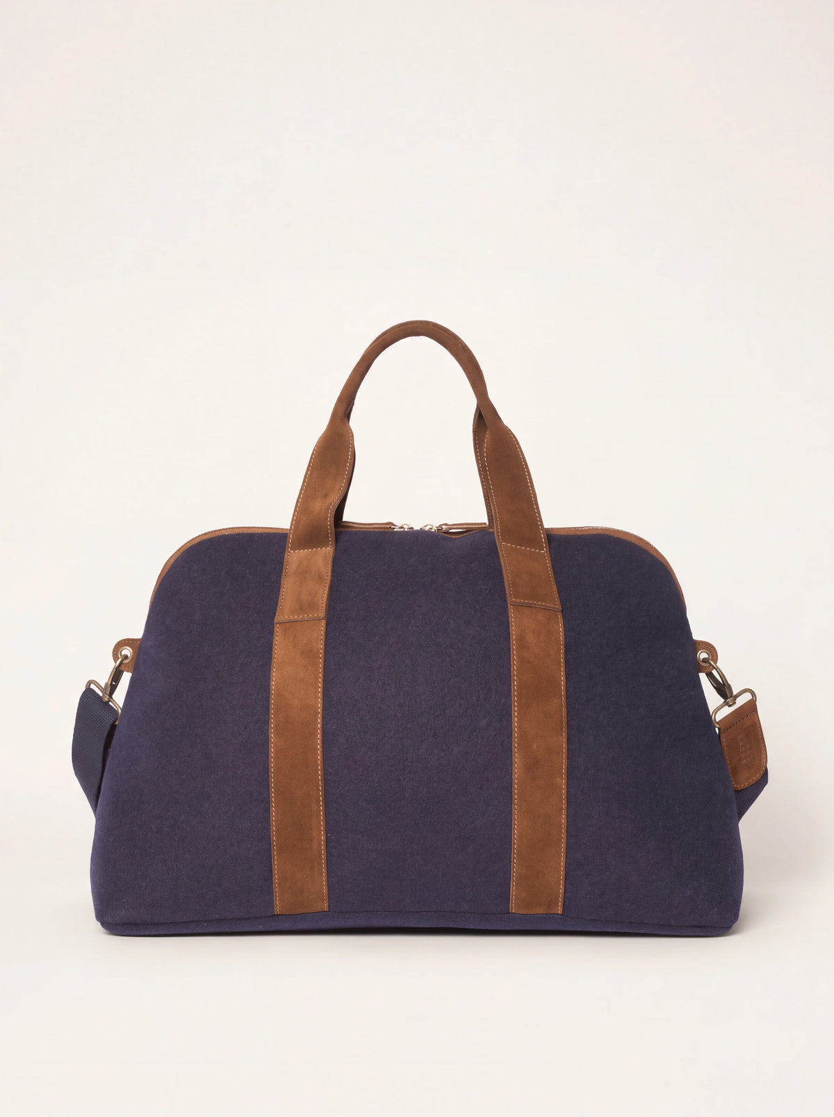 Blue wool felt travel bag with brown suede trim, carry handles and detachable shoulder strap