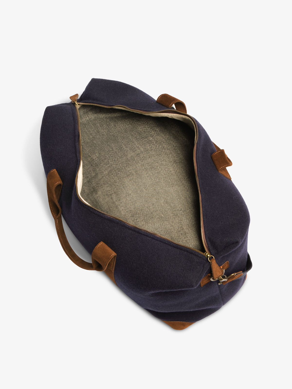 Top-down view into the unzipped weekender bag showing the woven interior lining