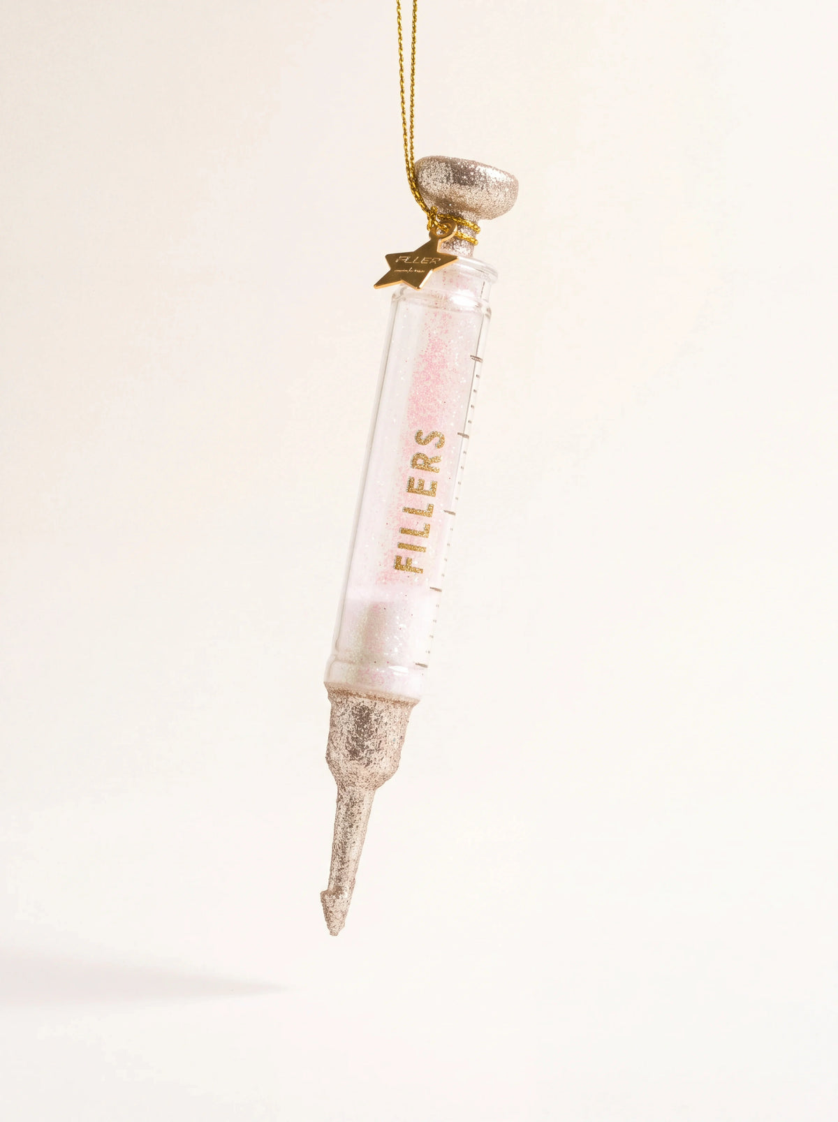 Glass syringe ornament with measurement markings, glitter details and gold "FILLERS" lettering