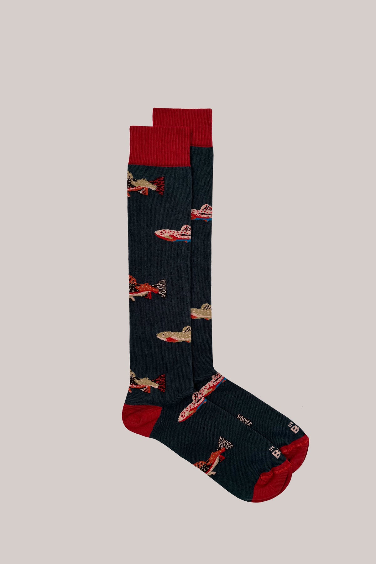 Dark green cotton socks with a fish pattern, red ribbed cuffs, heels and toes
