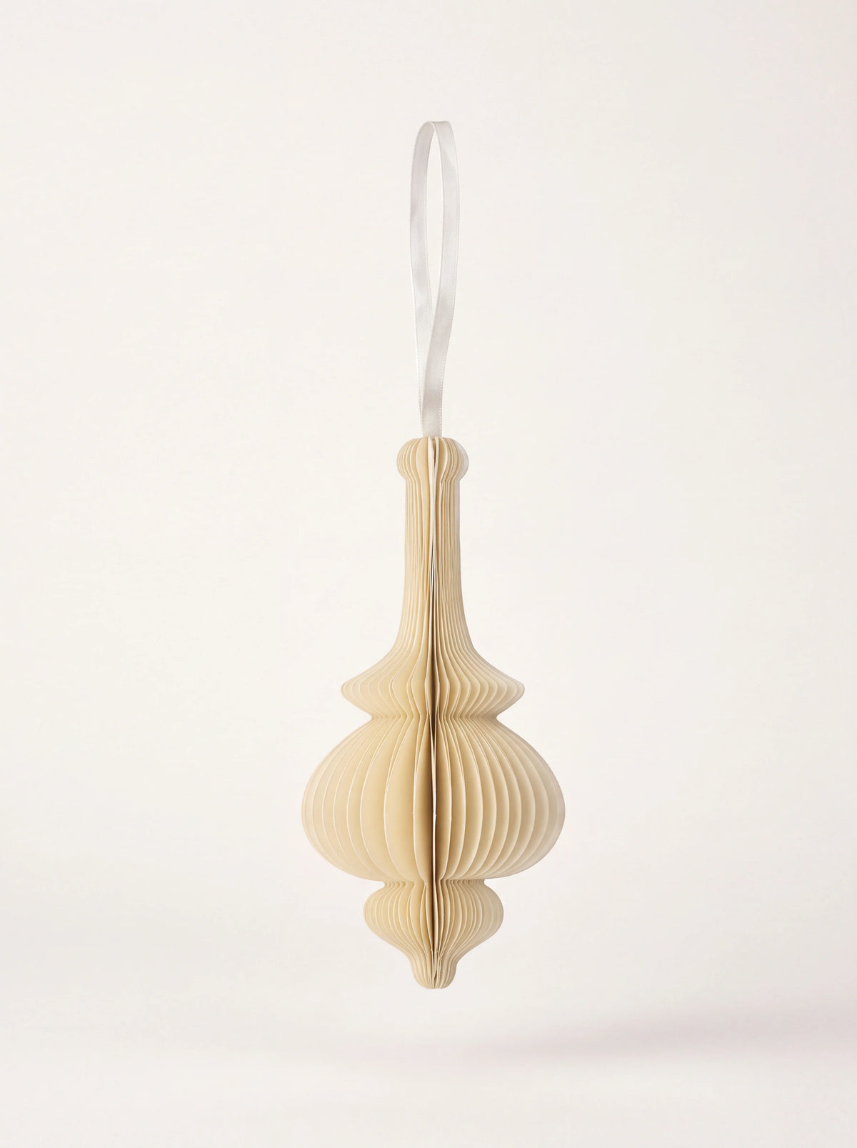 Cream paper honeycomb drop ornament with a silky hanging ribbon loop