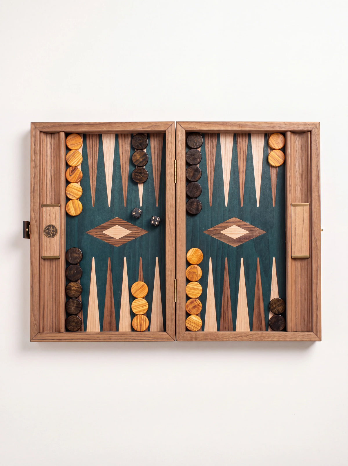 Open wooden backgammon set with green playing field, contrasting points, wooden checkers and dice