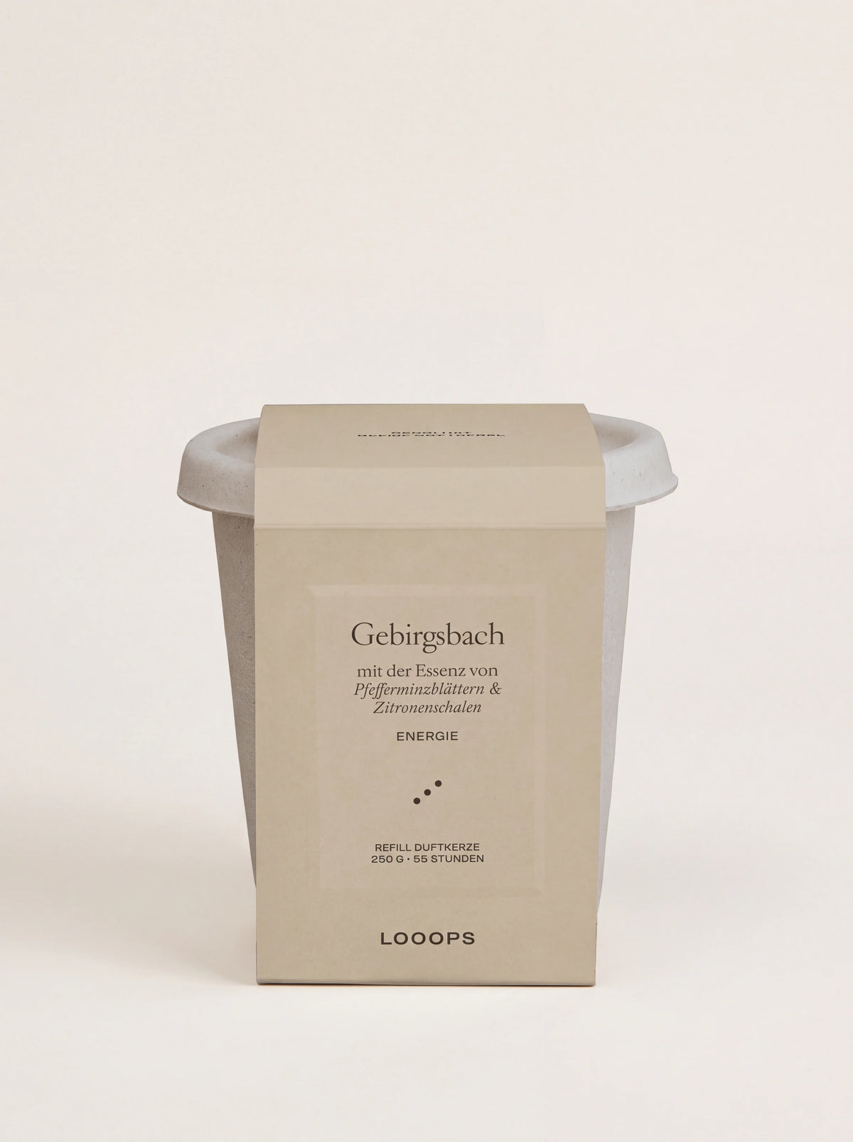 Scented candle refill in an off-white bagasse cup with a beige paper sleeve labelled Gebirgsbach