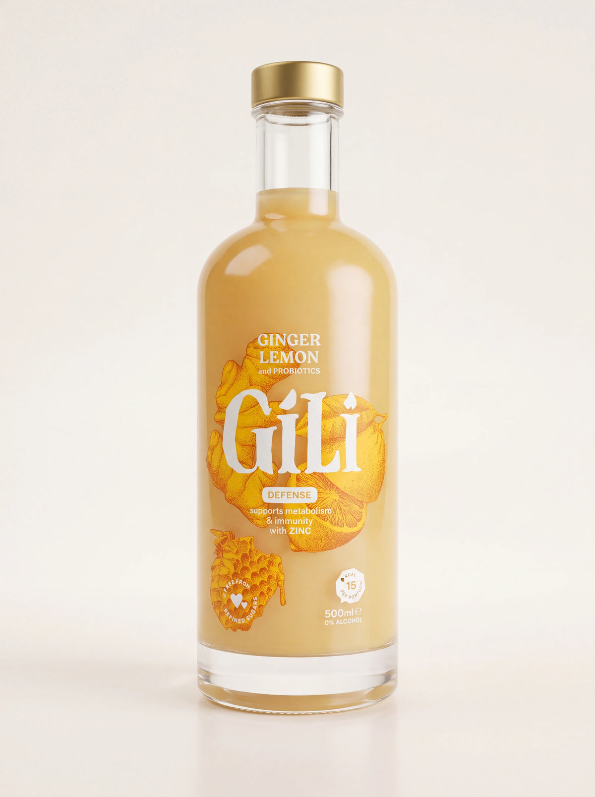 Organic ginger and lemon elixir in a 500 ml clear glass bottle with a gold screw cap