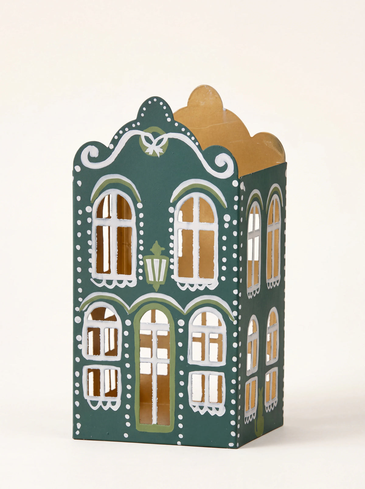 Forest green gabled metal house candle holder with hand-painted white accents and cut-out arched windows