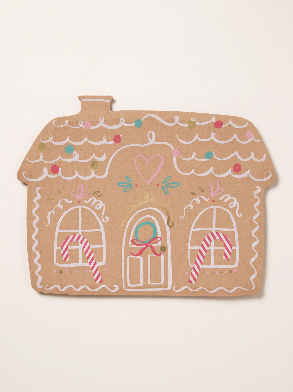 Gingerbread house-shaped paper plate with printed white icing details, candy canes and colourful accents