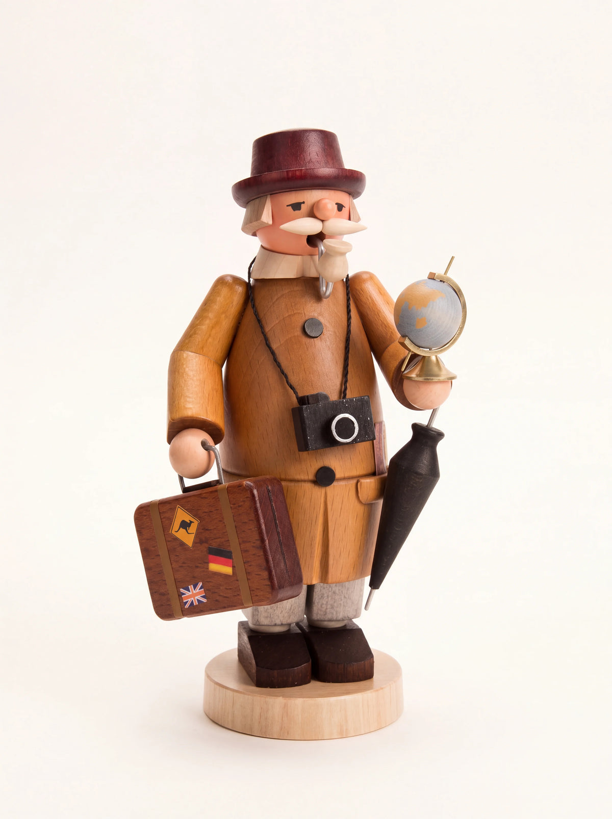 Wooden incense smoker shaped as a globetrotter with a suitcase, camera, umbrella and globe