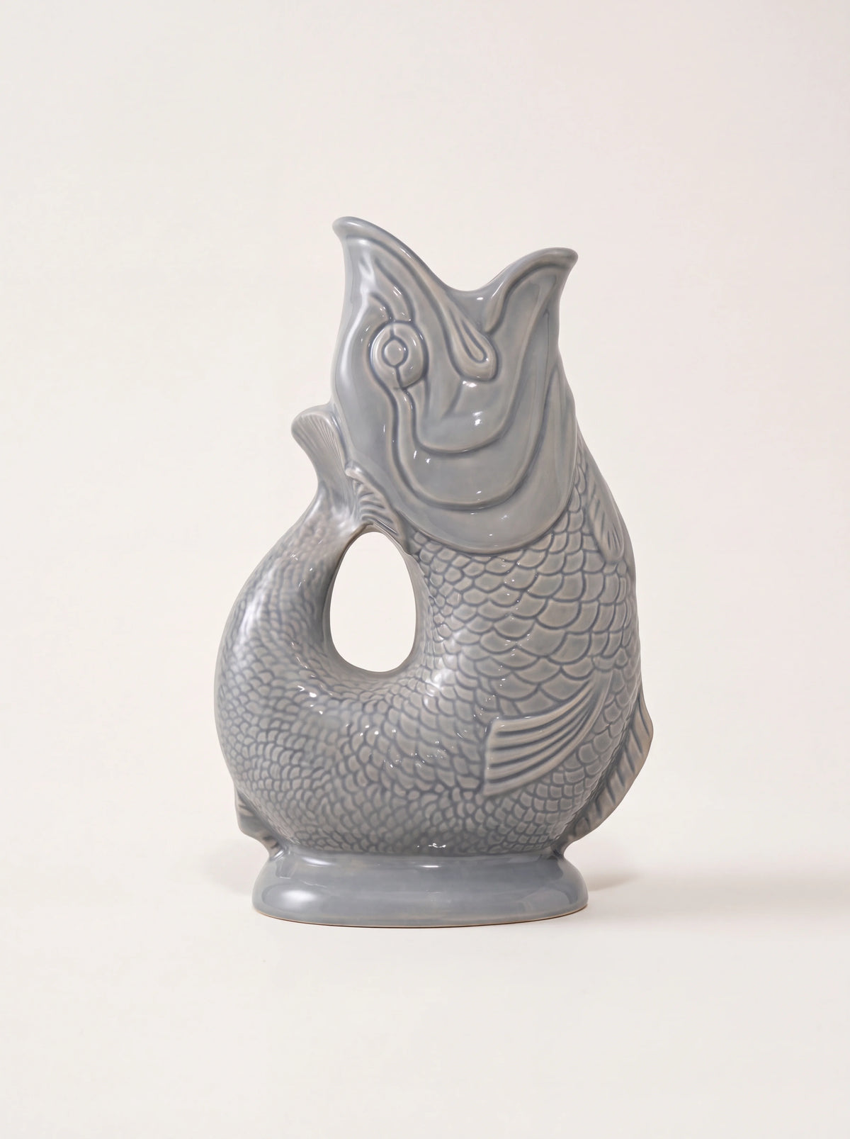 Dark grey glazed porcelain fish jug with an open-mouth spout and curved tail handle