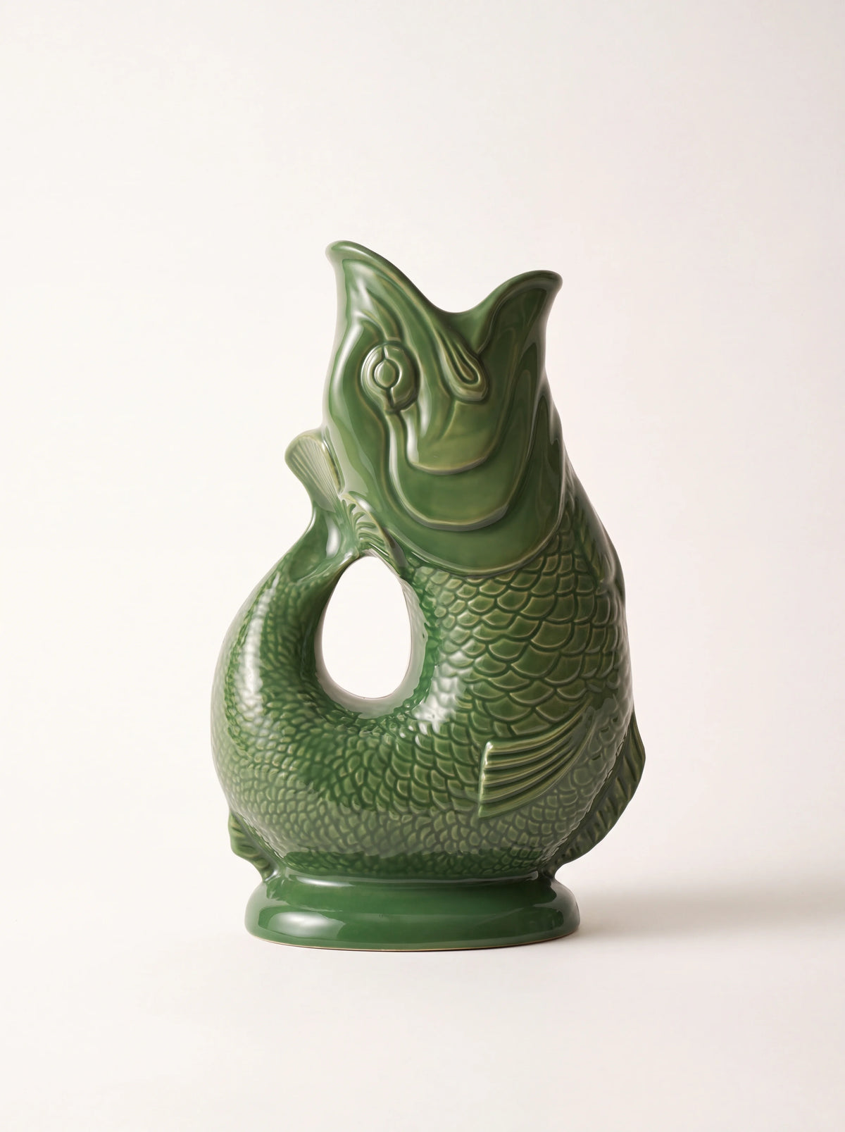 Green glazed porcelain fish jug with embossed scales and an open-mouth spout