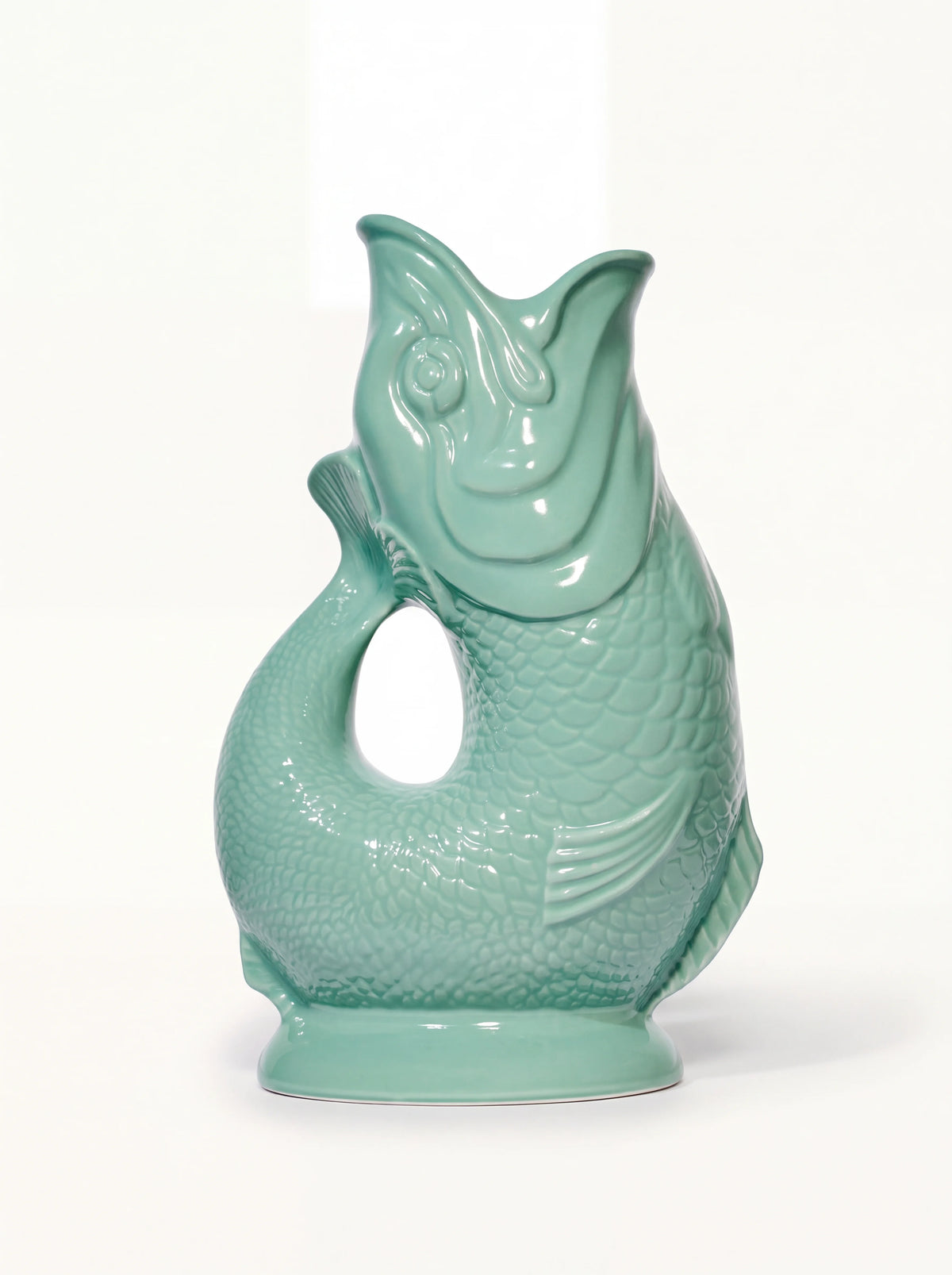 Sea green glazed porcelain fish jug with embossed scales and an open-mouth spout