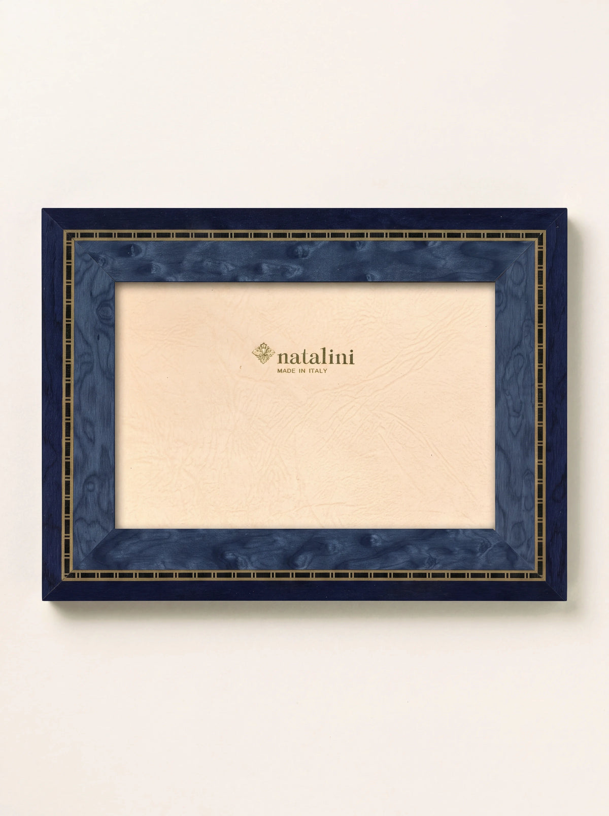 Rectangular blue wood veneer photo frame with an inlaid border and insert reading natalini MADE IN ITALY