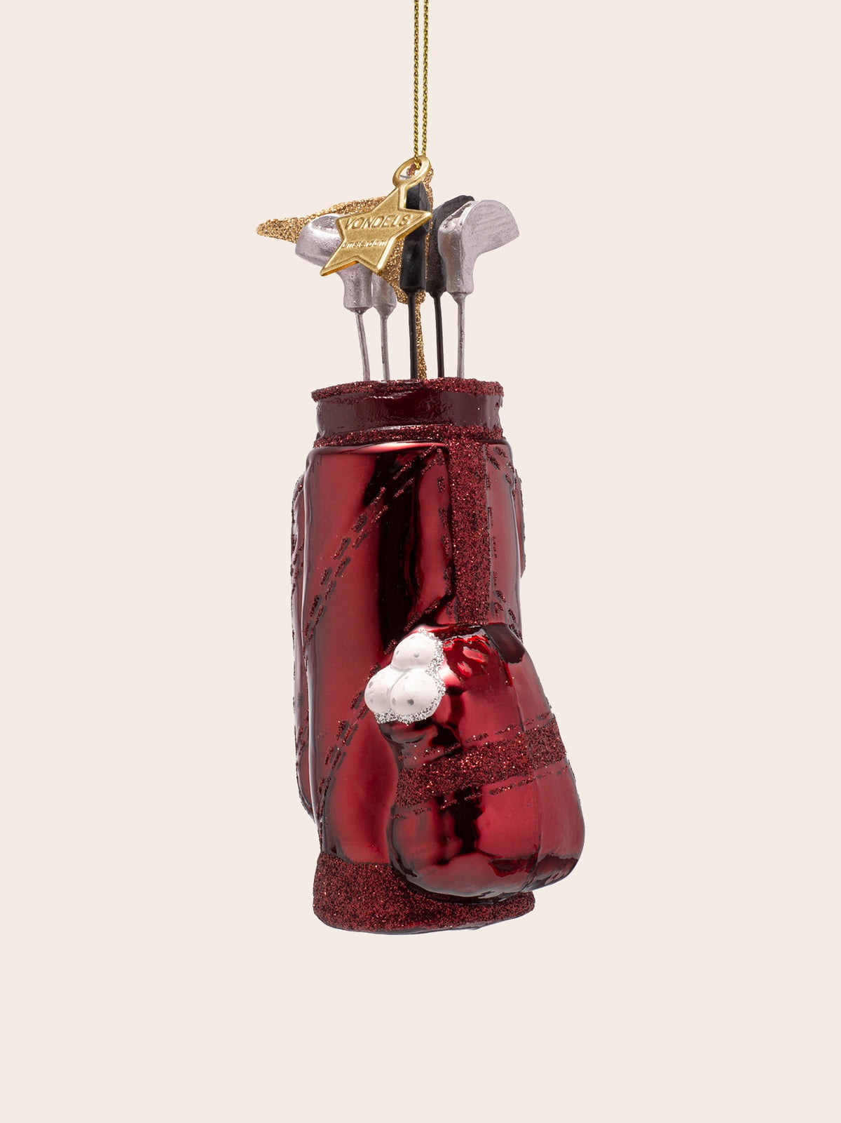 Front view focused on the pocket of golf balls and club heads topped with a gold hanging loop