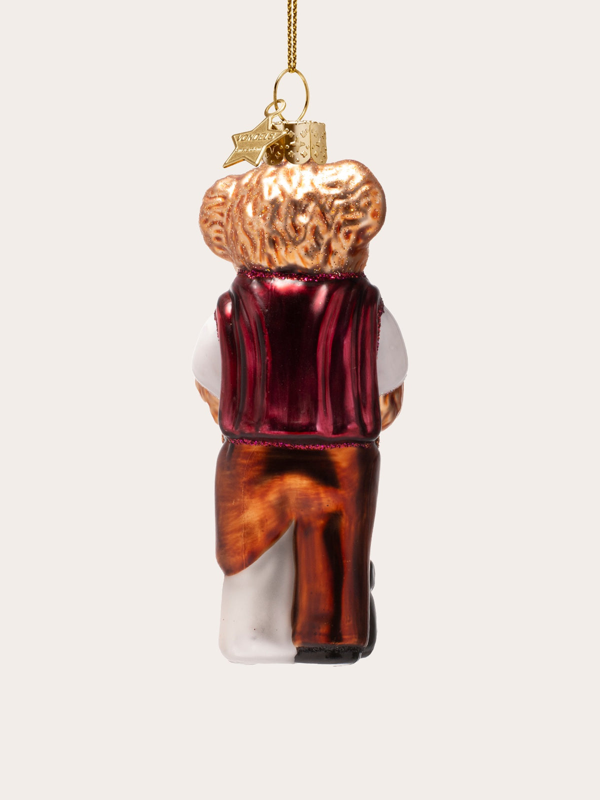 Rear view of the glass bear ornament showing the draped red jumper and trousers