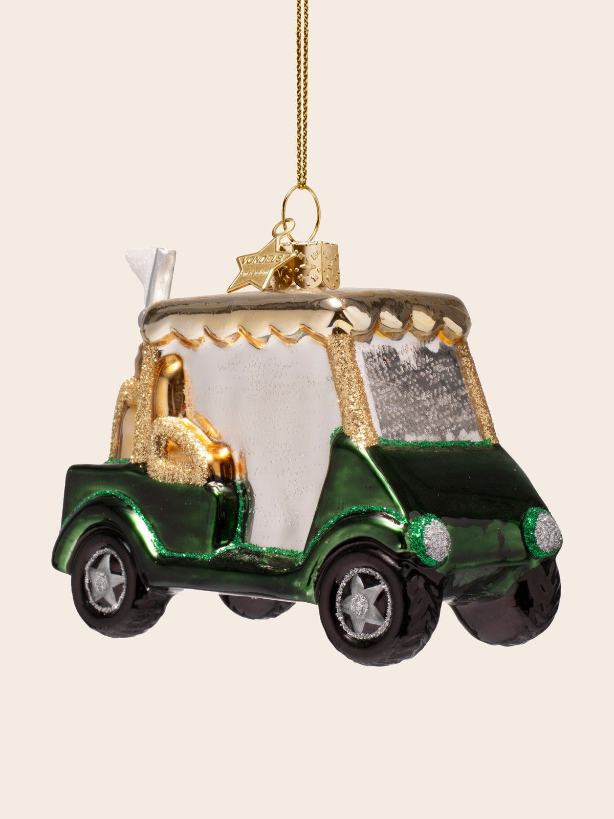 Right side profile showing the rear golf bag, flag and scalloped gold canopy