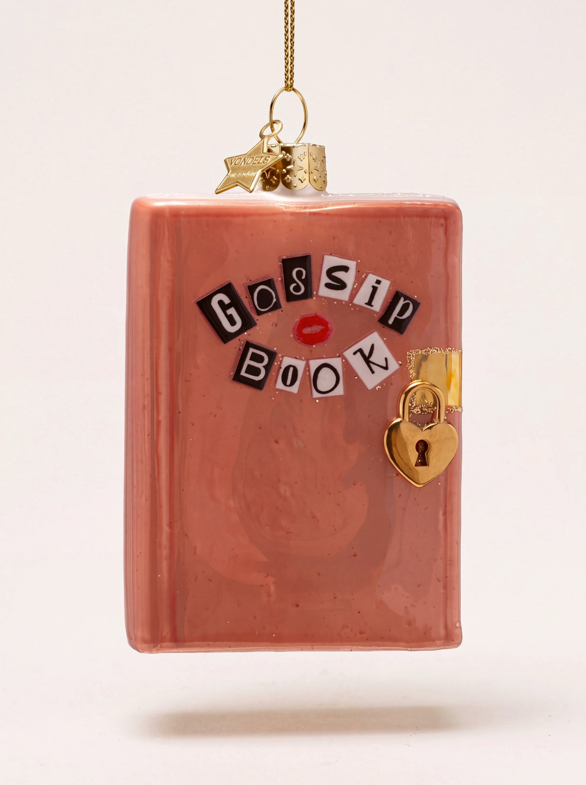 Pink glass diary ornament featuring collage-style 'Gossip Book' lettering and a gold heart lock