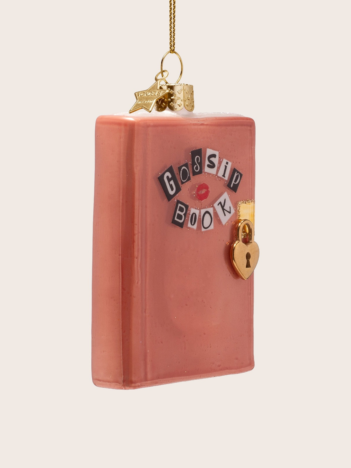 Pink glass diary ornament angled to show its thickness and the raised gold heart lock
