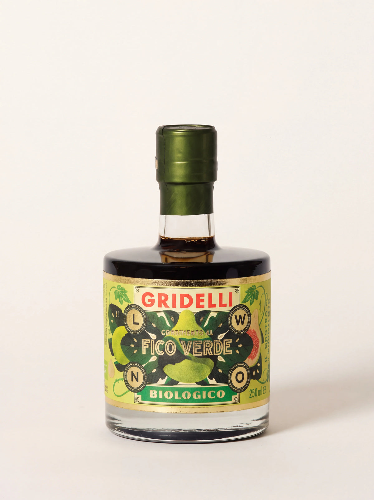Green fig balsamic vinegar in a round glass bottle with a green foil neck and illustrated label