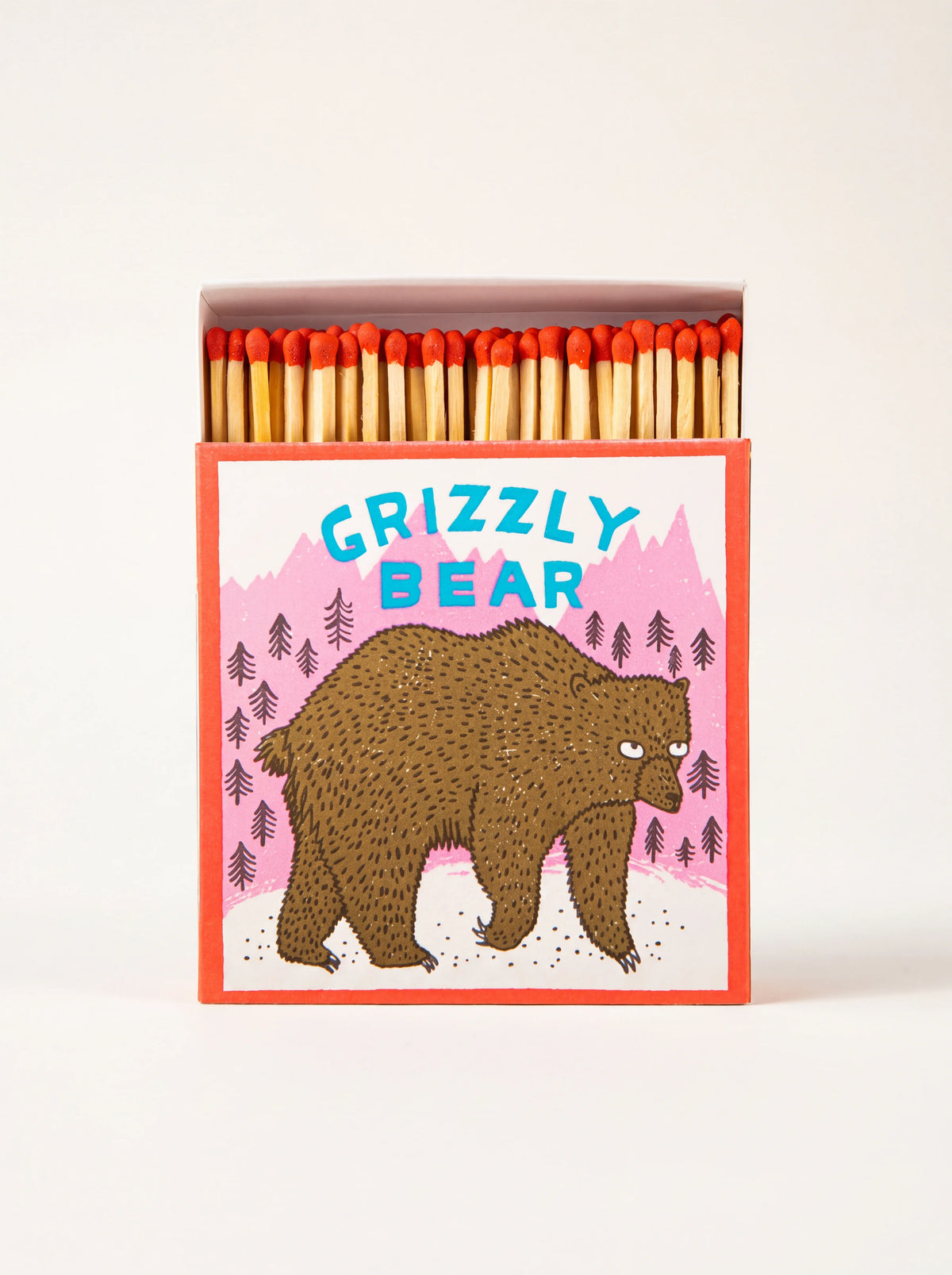 Square matchbox featuring a bear illustration and GRIZZLY BEAR text, opened to reveal red-tipped matches