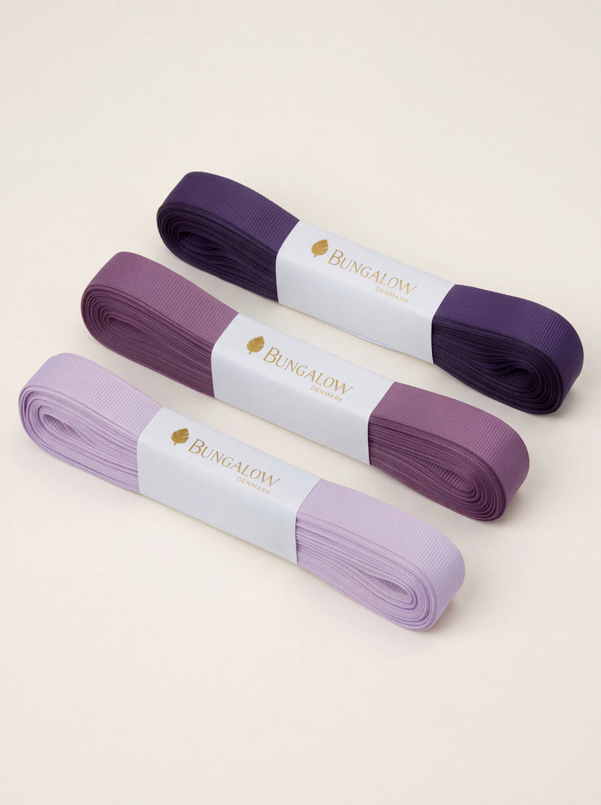 Grosgrain ribbon set of three in shades of purple, bundled with paper bands reading BUNGALOW DENMARK