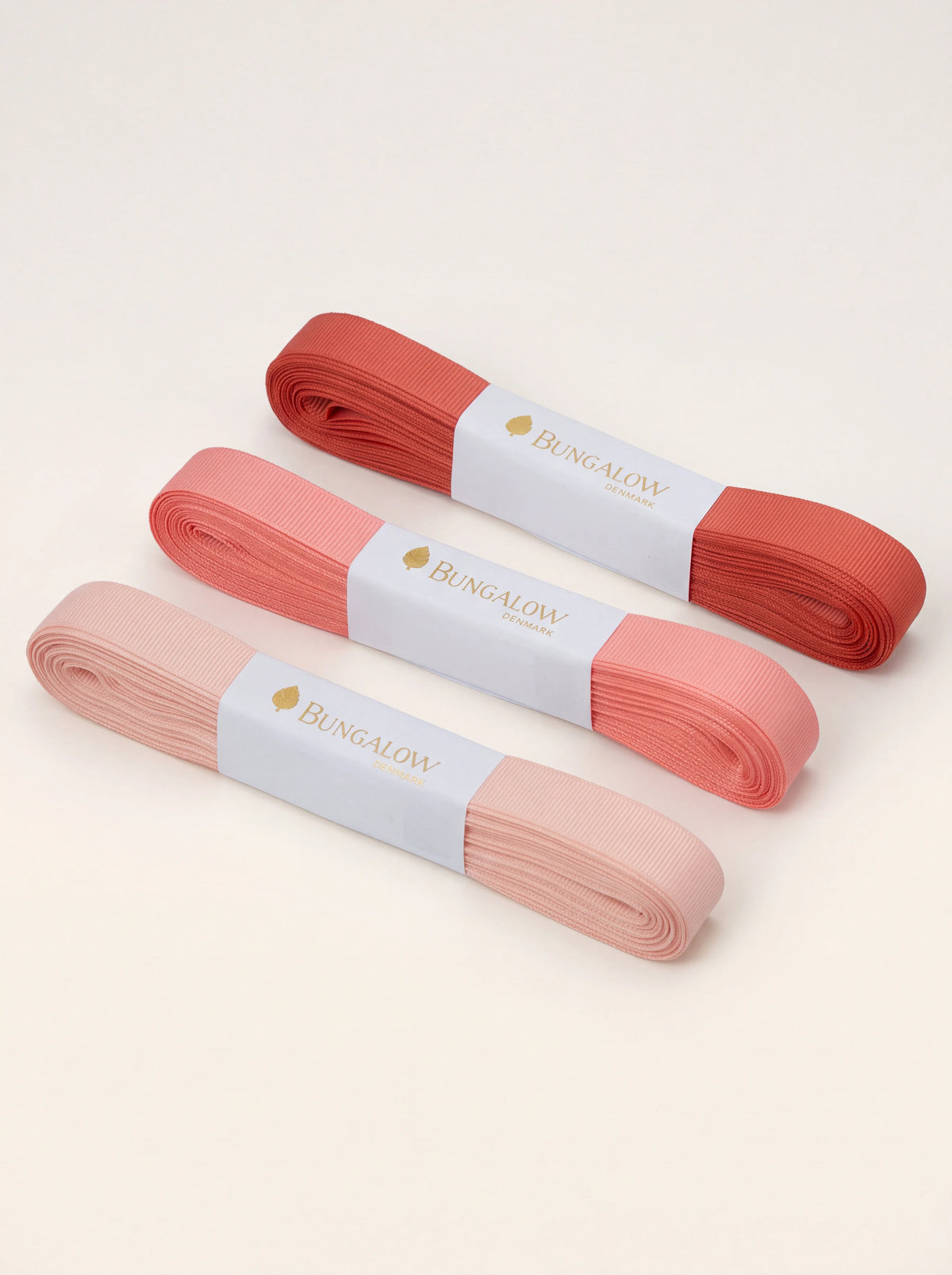 Grosgrain ribbon set of three skeins in tonal shades of pale peach, coral and rust