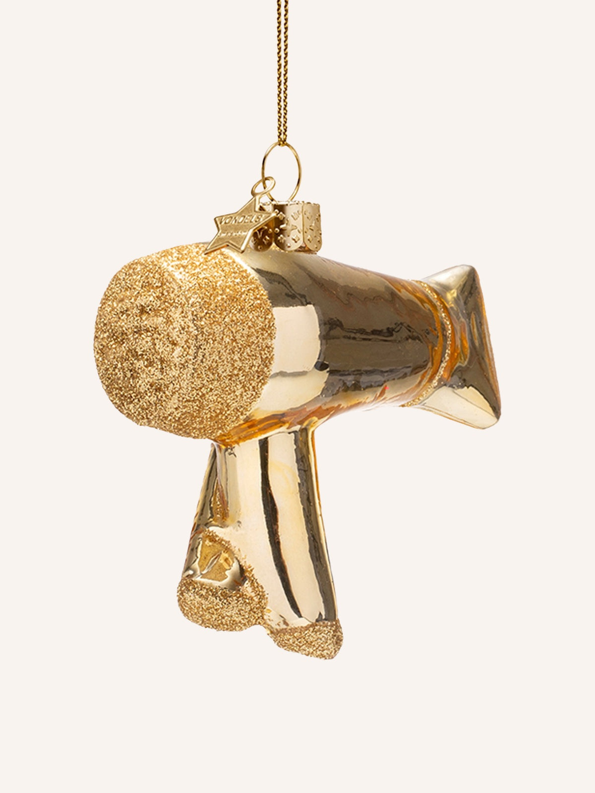 Rear of the gold glass hair dryer ornament showing the textured glitter air filter