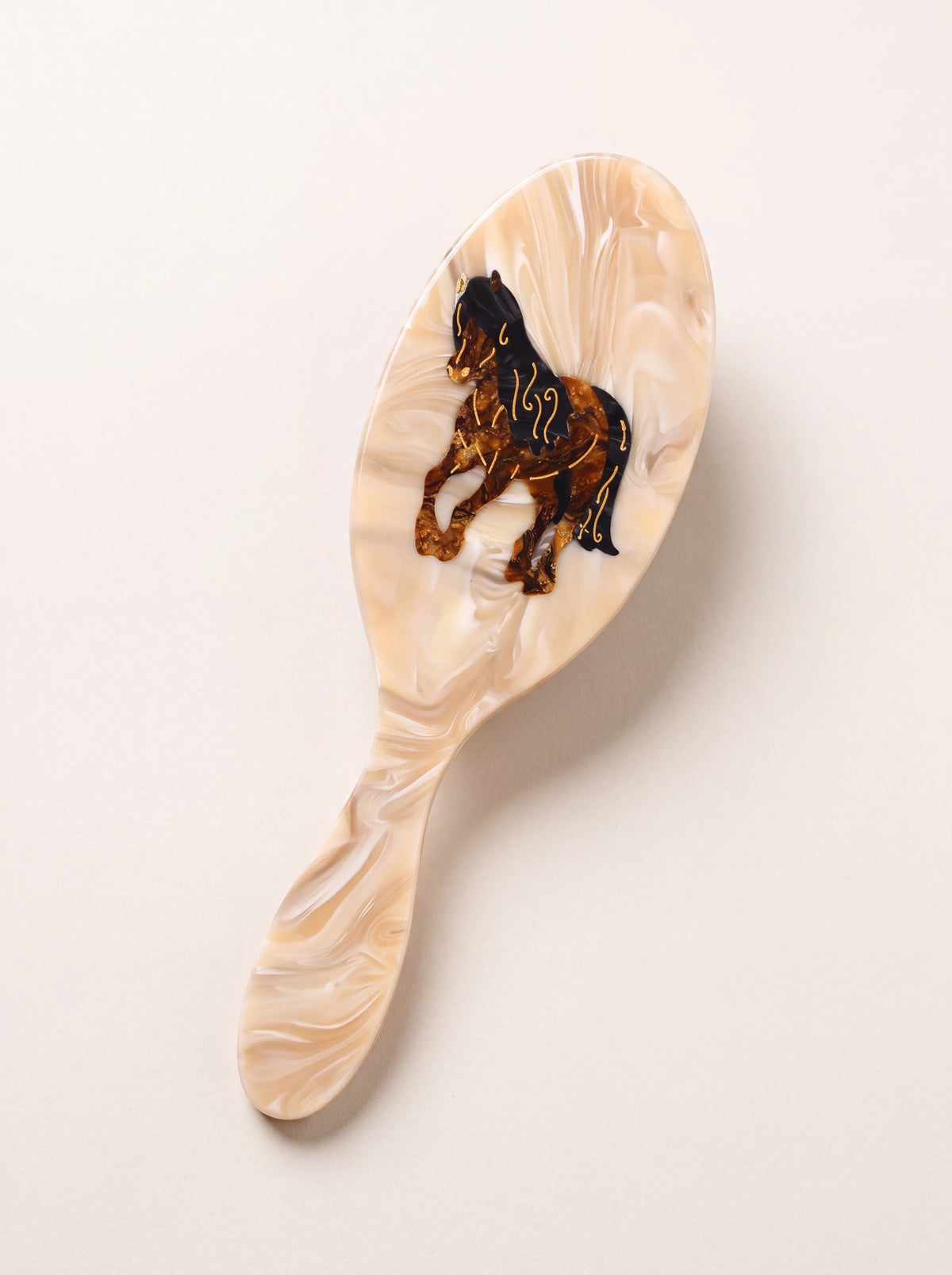 Marbled beige cellulose acetate hairbrush with a hand-painted horse motif
