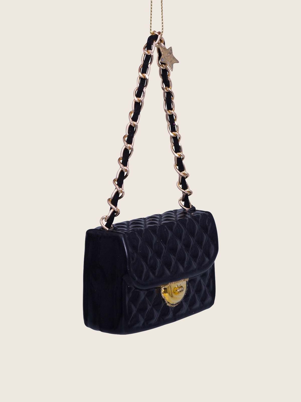 Side view of the black handbag ornament showing its depth and rectangular profile