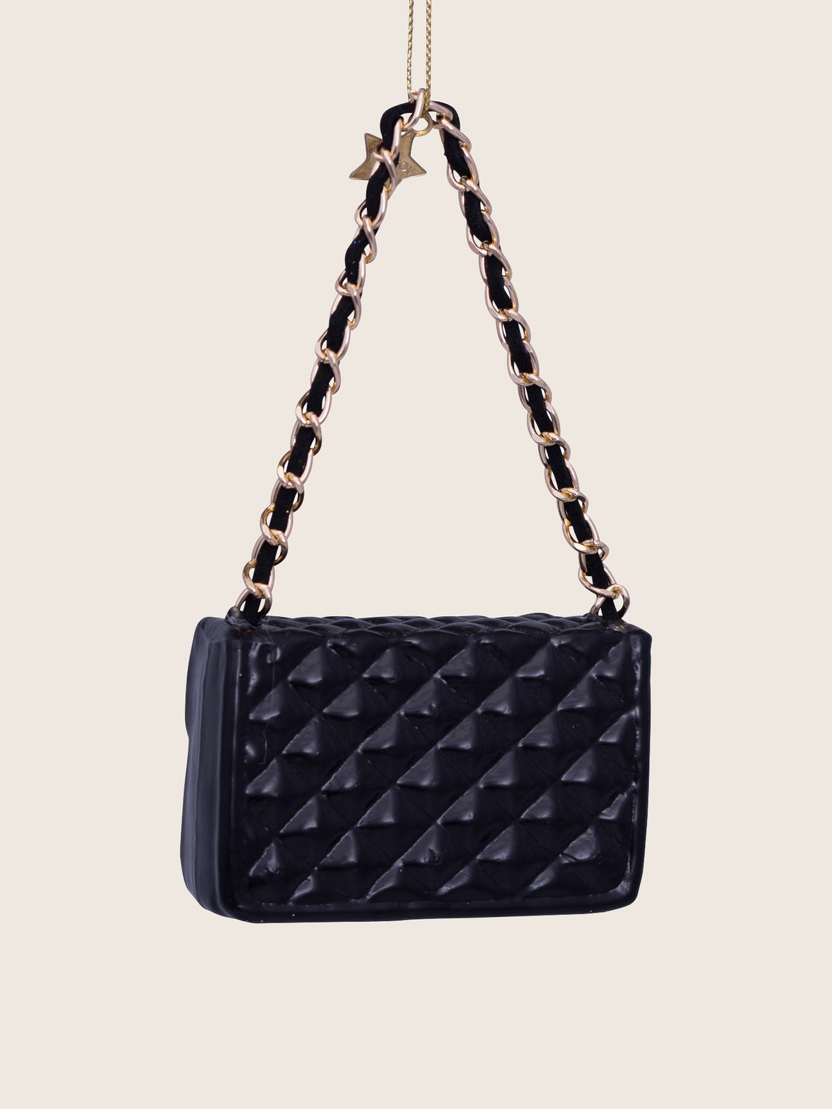 Rear view of the black handbag ornament displaying the quilted diamond pattern