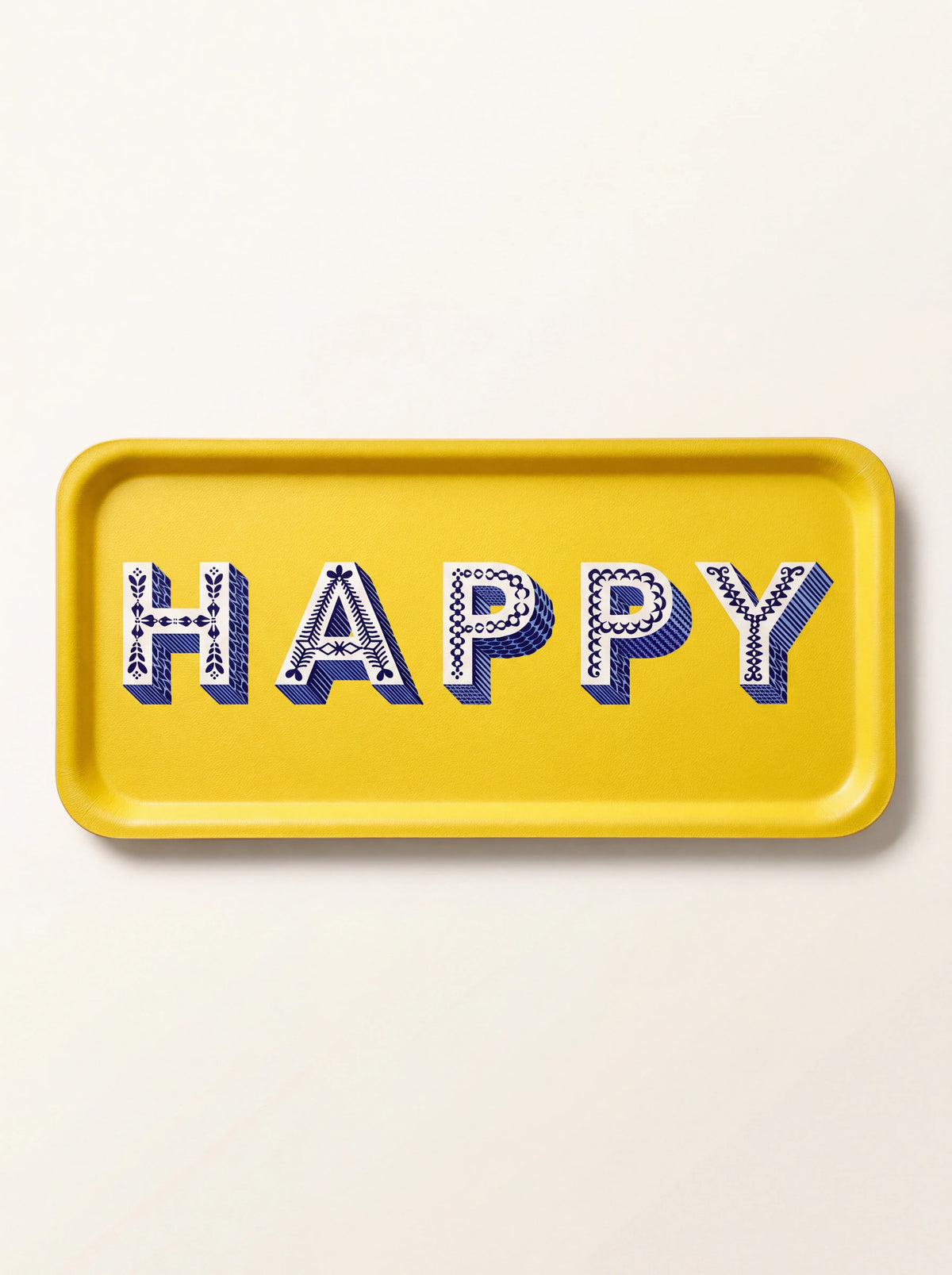 Rectangular yellow serving tray with patterned blue-and-white lettering reading HAPPY across the centre