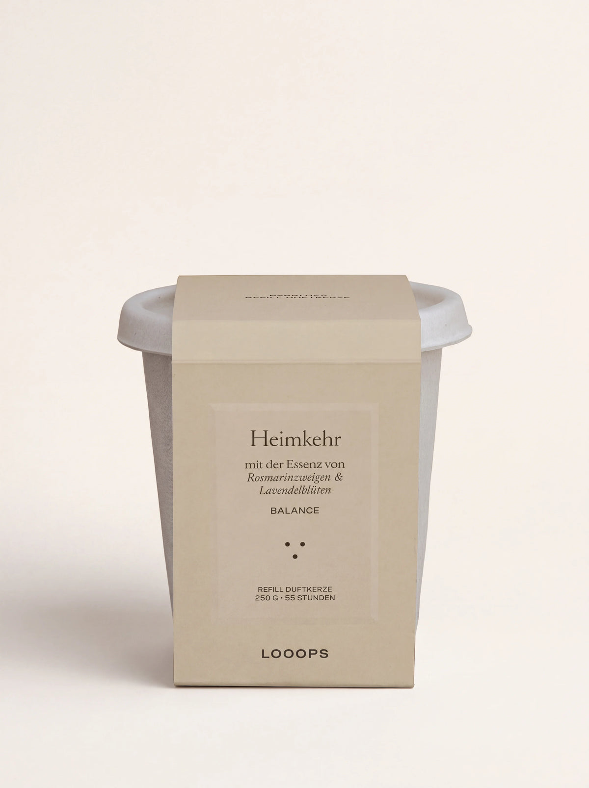 Scented candle refill in an off-white bagasse cup with a beige paper sleeve labelled Heimkehr