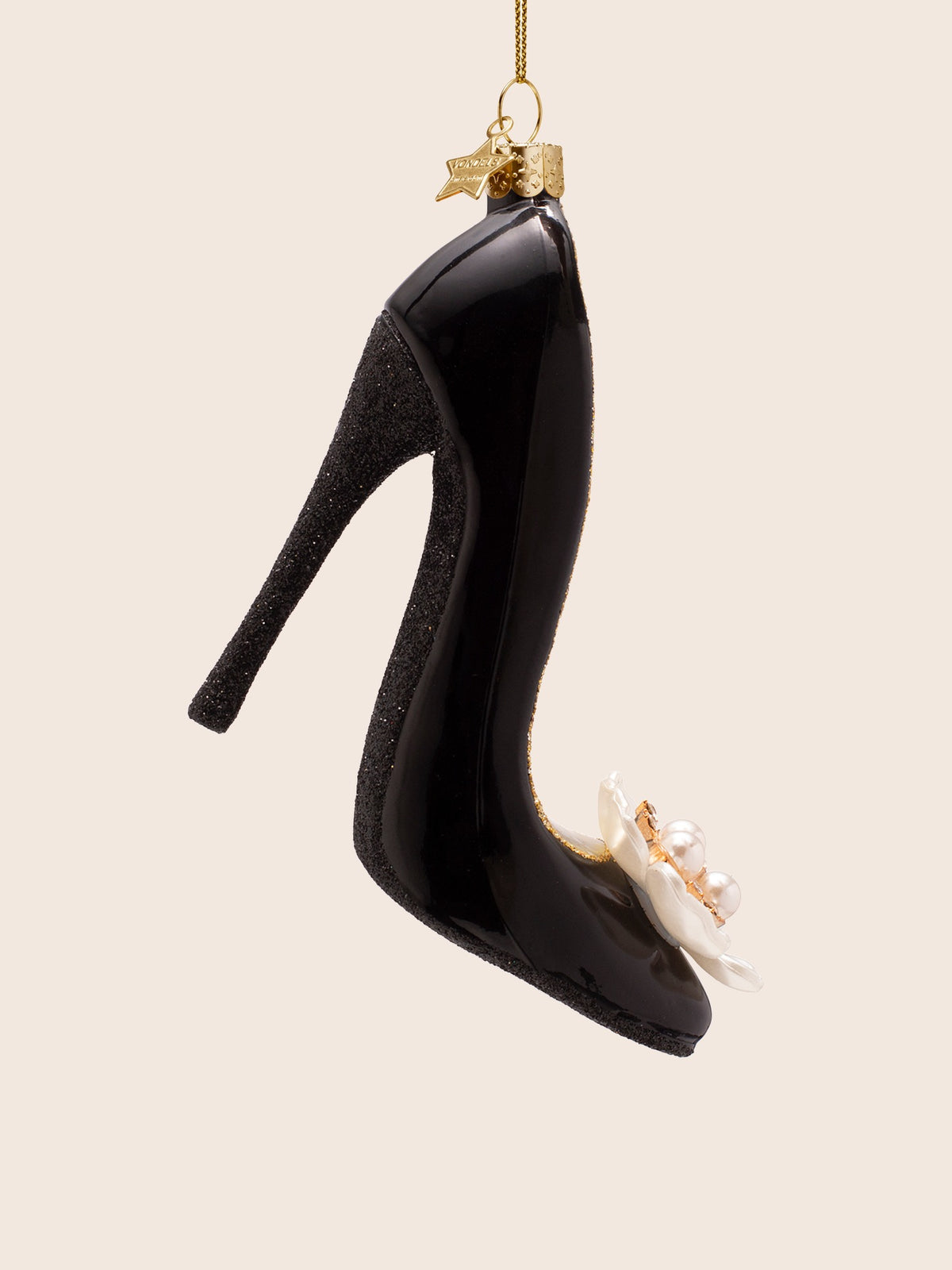 Side profile showing the arched silhouette, slender glitter heel and pointed toe