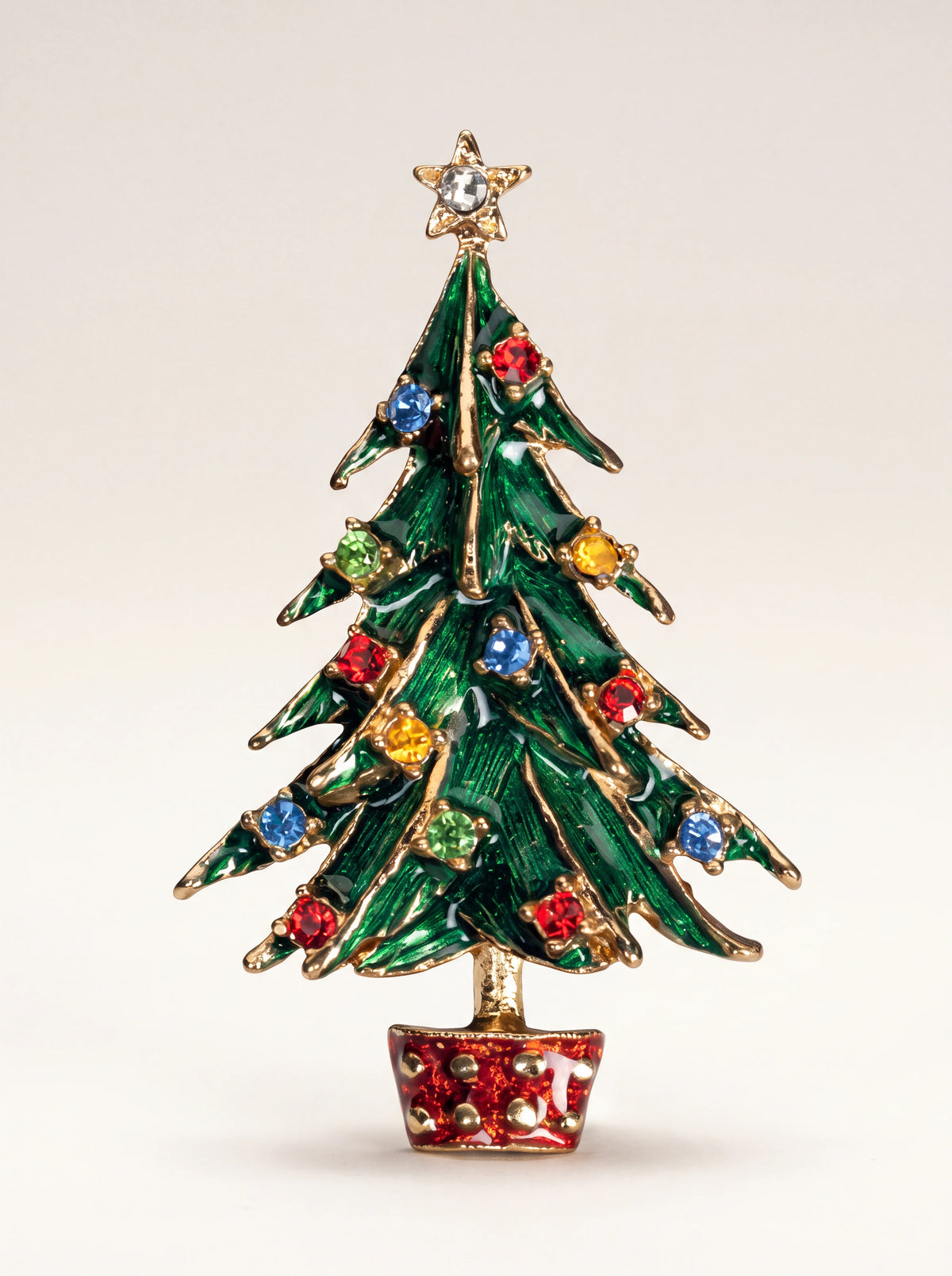 Green enamelled Christmas tree brooch with multicoloured crystal stones, a star topper and red pot
