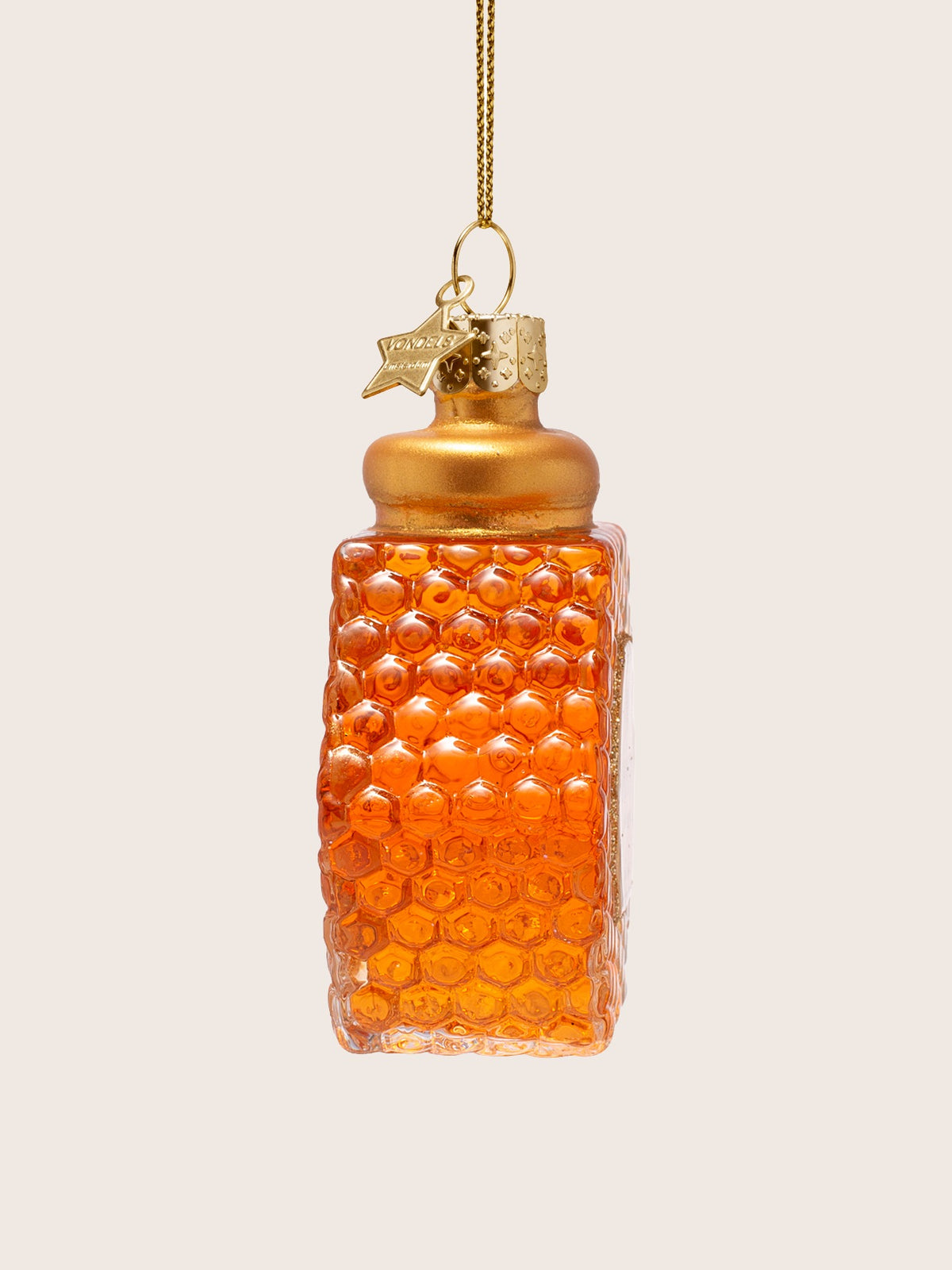 Side profile showing the narrow rectangular depth covered in the amber glass honeycomb texture