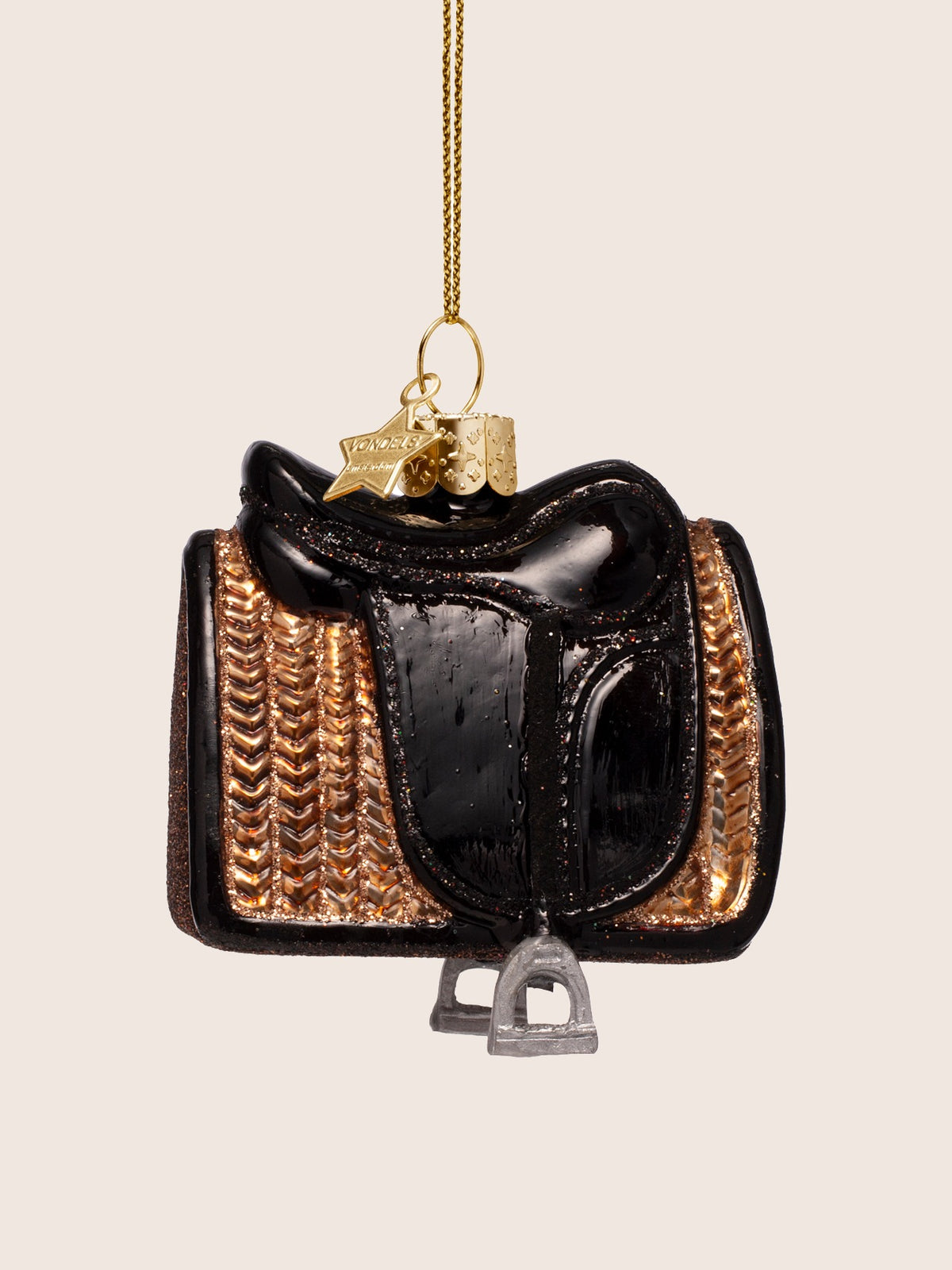 Reverse side of the glass horse saddle ornament showing the opposite saddle flap and textured pad