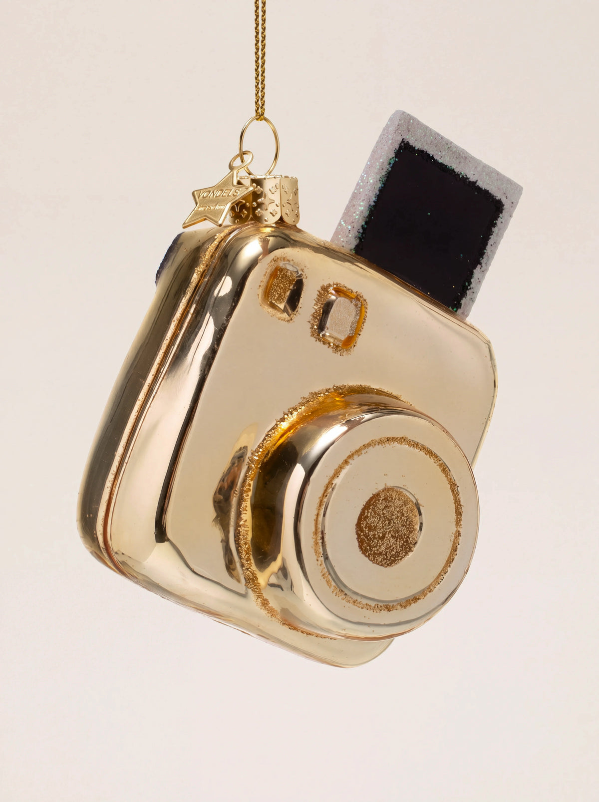 Glass instant camera Christmas ornament in shiny gold with an emerging glitter-edged photo