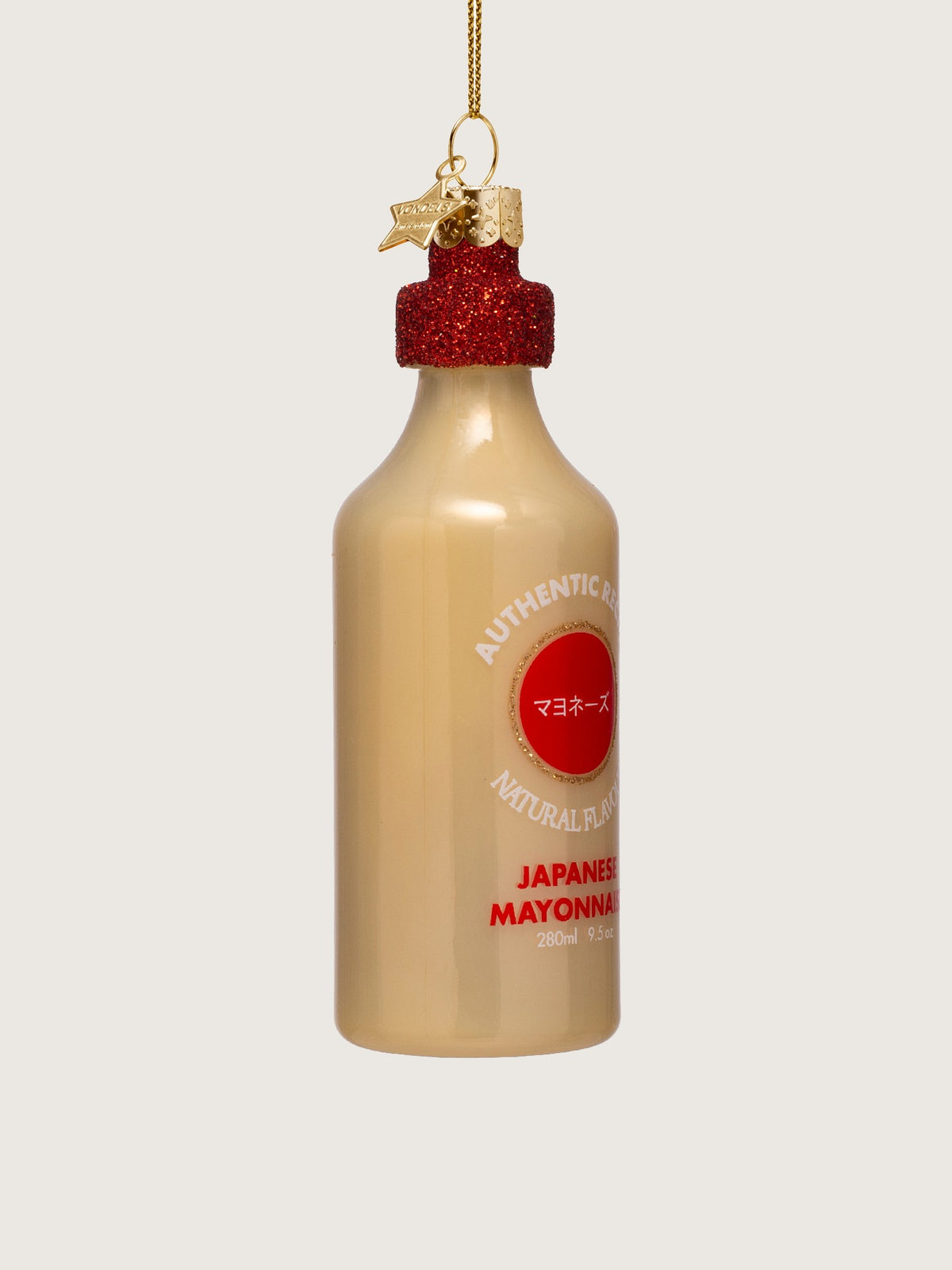 Three-quarter view of the Japanese mayonnaise ornament showing its rounded bottle shape and glossy finish