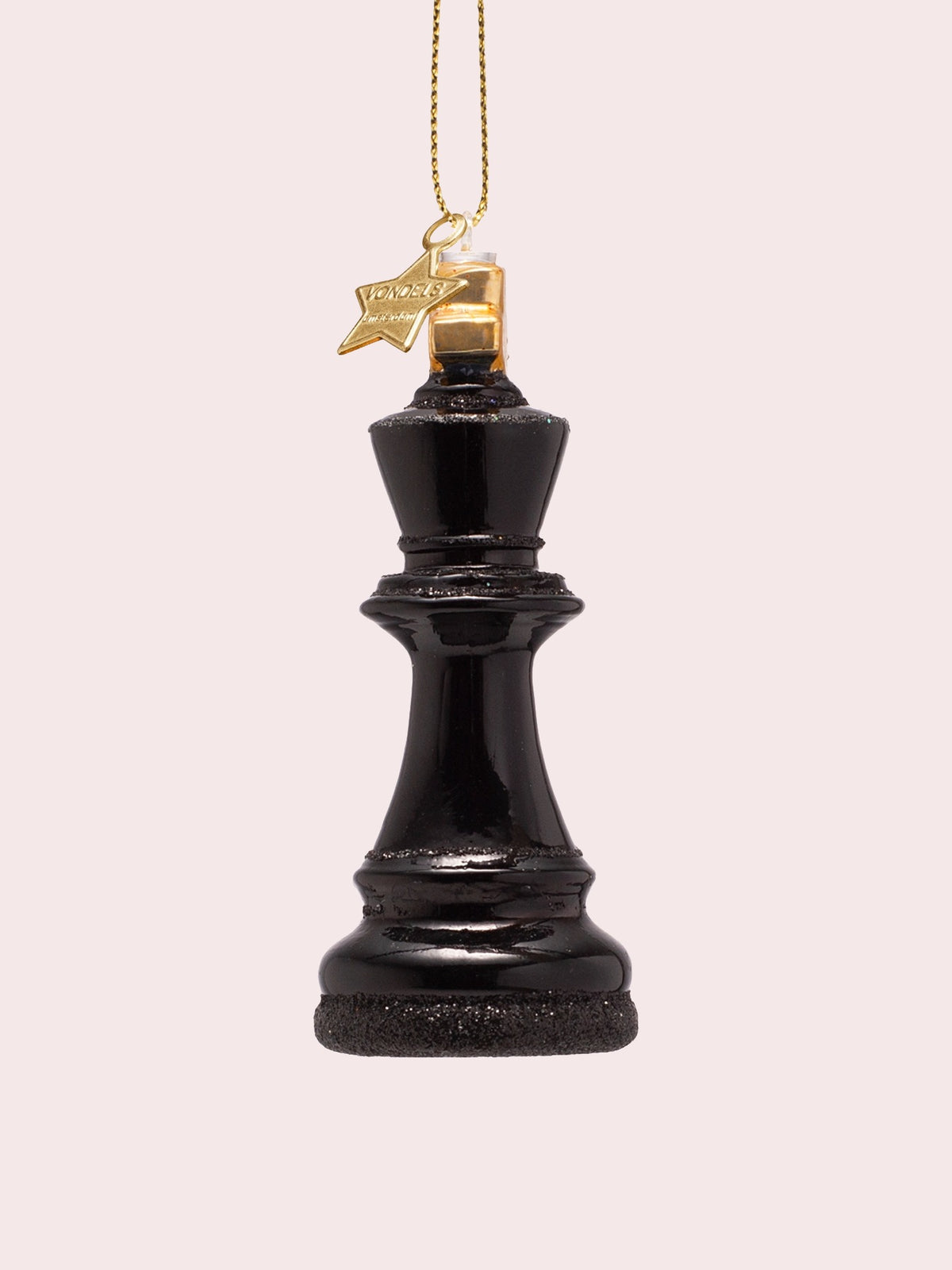 King chess piece ornament turned slightly, showing glitter borders along the tiers and base
