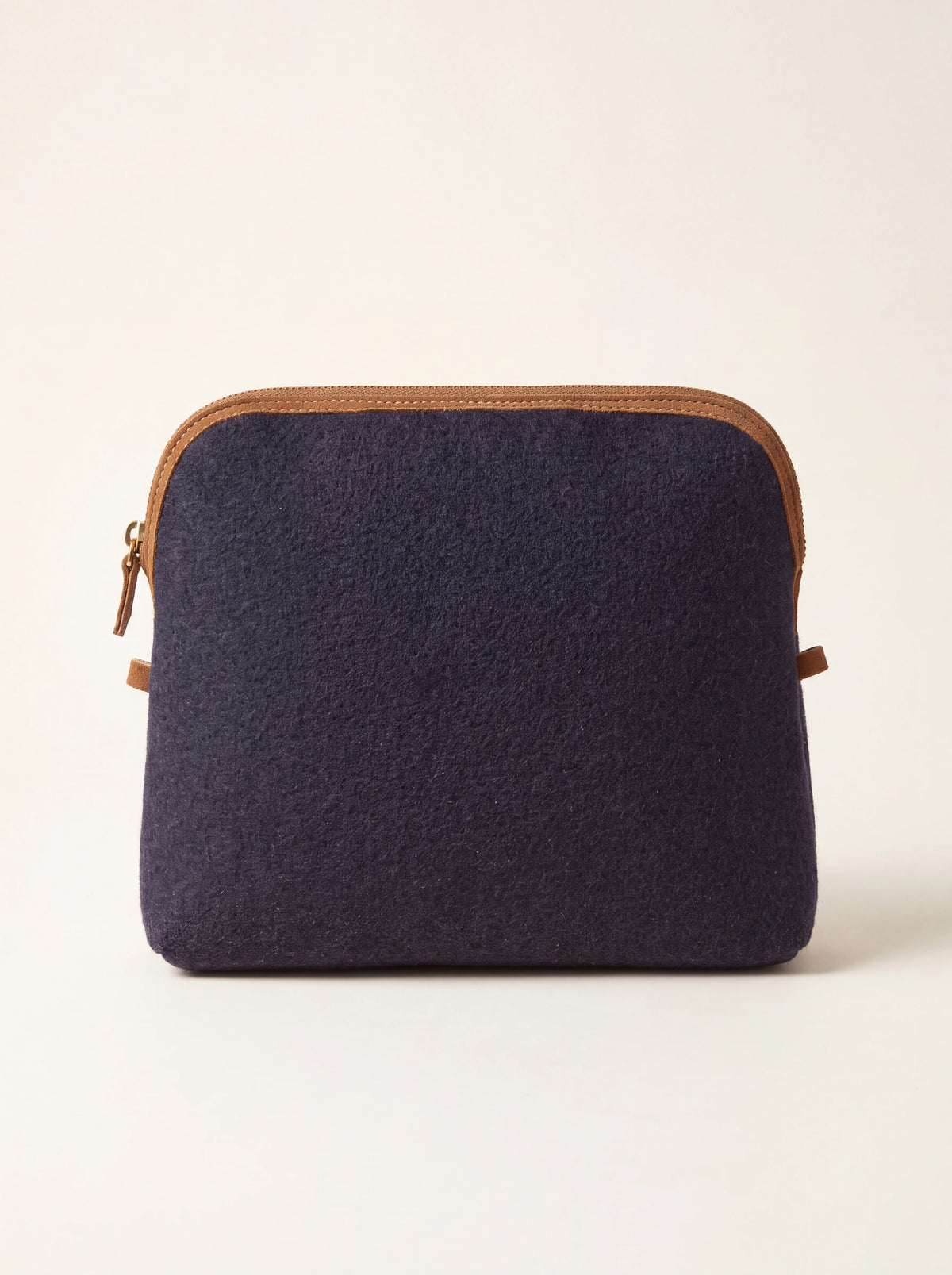 Blue wool felt pouch with brown suede trim along the curved top zip